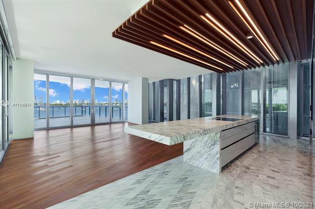 Never been lived masterpiece Only unit with X-large terrace featuring a water feature & private staircase leading from terrace down to pool/jacuzzi. Custom Polyform built out closets. Composed of 59 individually designed waterfront residences around a glittering lagoon Monad Terrace by Pritzker Winner Jean Nouvel, provides brilliant light, private outdoor space, climbing gardens, unique sawtooth honeycomb facades & stunning sunset views of Biscayne Bay. Kitchens with dramatic sculptural marble island in Calacatta. Master baths with richly veined, spacious stone countertops, marquetry flooring & tiled walls. Other notable features include custom cabinetry & built-in features, designer fixtures, teak flooring throughout & private elevators. Walk to the best areas in south beach and the ocean
