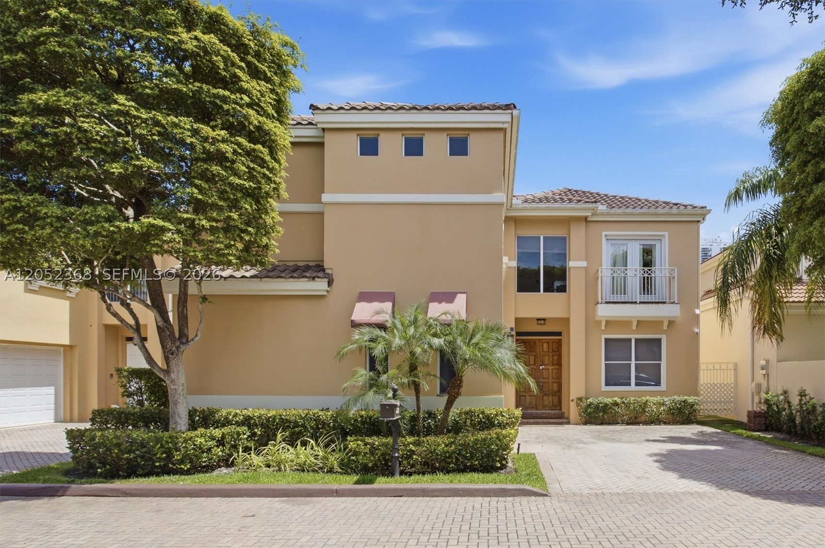 Great opportunity to buy your new home in the highly sought-after gated community of IslandWay in Aventura. This beautiful residence features 3 bedrooms, 4 bathrooms, and an amazing two-story ceiling, complemented by expansive windows that bathe the home in natural light, creating a bright and inviting ambiance throughout. The spacious living and dining areas flow into a large kitchen with abundant cabinetry, generous counter space, and a comfortable breakfast area, making it ideal for everyday living. From both the kitchen and living room, step outside to your private outdoor retreat with a pool and covered patio with an outdoor sink perfect for al fresco dining, weekend gatherings, relaxing, and enjoying Florida's year-round sunshine. The first-floorbedroom offers versatility as a bedroom, home office, or media room, with custom built-ins. Upstairs, enjoy a huge master loft-style suite with a sitting area and walk-in closet. A second en-suite bedroom and a multi-use hall complete the upper level. Laundry, storage area, 2-car garage, extra driveway parking spaces, and a full bathroom near the pool bring convenience. Island Way residents enjoy a unique waterfront lifestyle with access to a scenic promenade along the water, inviting to peaceful walks, stunning water views, tranquil moments surrounded by landscaping, and access to the marina. All just minutes from A-rated schools and Aventura’s premier shopping, dining, and entertainment.