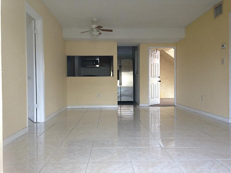 Great spacious 3 beds unit located near major roads , highways and  Sawgrass Mill .Nice safe community. It has assigned parking right in front of unit.. Title floor throughout unit..Steel appliances and a large covered porch