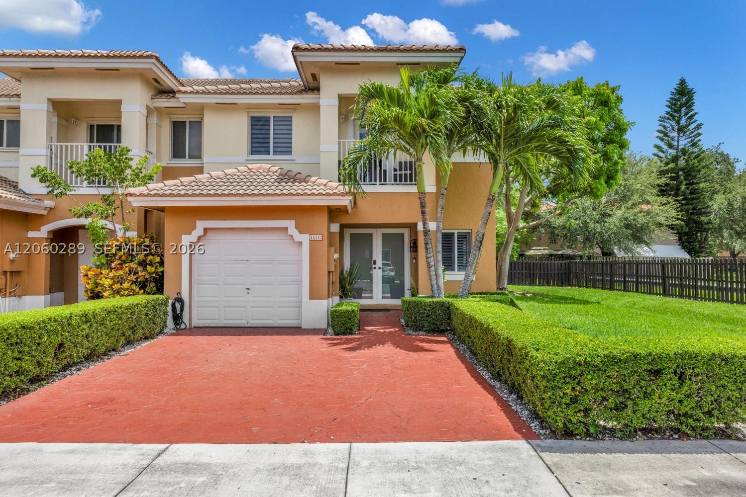 Welcome home to this beautifully updated 4-bedroom, 2.5-bath corner unit offering 2,179 sq ft of living space plus an attached garage. Enjoy added privacy and natural light thanks to the desirable corner lot position.

Step inside to an open, flowing floor plan with wood-look flooring throughout the main level, recessed lighting, and plantation shutters. The spacious living and dining areas connect seamlessly to a fully renovated kitchen featuring white shaker cabinets, quartz countertops, stainless steel appliances, and a breakfast bar with pendant lighting. A cozy family room opens to the outdoors, perfect for everyday living and entertaining.

Retreat to the primary suite, complete with a private balcony, spa-like en-suite bath with a soaking tub, glass-enclosed walk-in shower, dual vanities, and a generous walk-in closet.

Outside, unwind under the large covered, screened patio ideal for Florida living year-round, with room for dining, grilling, and lounging in a lush, hedge-lined backyard. 

Additional highlights include a one-car garage, extended driveway, and a prime location close to shopping, dining, and major roadways. Move-in ready and thoughtfully upgraded