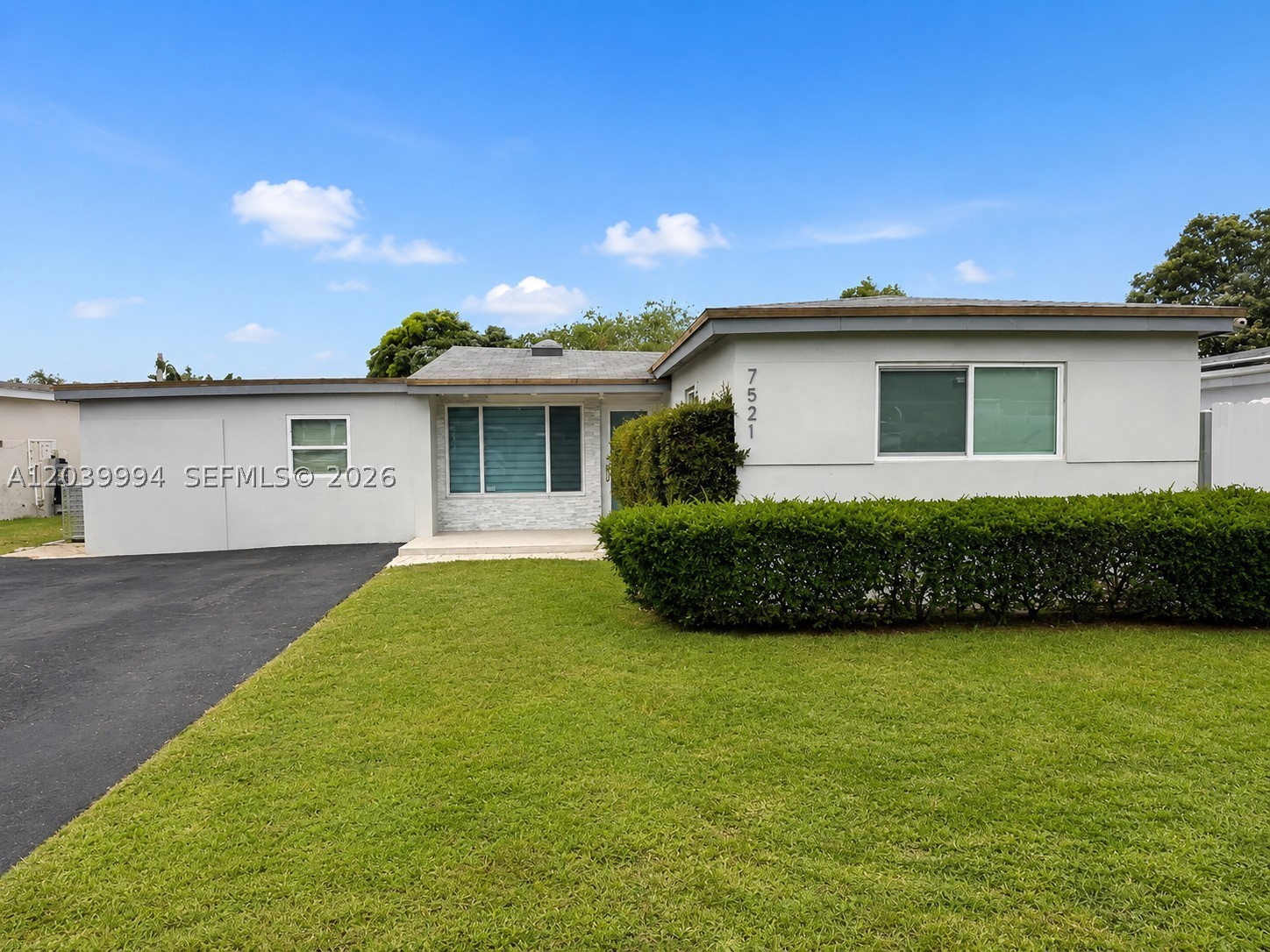 Fully remodeled and move-in ready! This beautiful 4-bedroom, 3-bath residence offers a modern open-concept design with high-end finishes throughout. Features include a stunning contemporary kitchen with quartz countertops and oversized island, impact windows and doors, updated bathrooms, large-format porcelain tile flooring, and custom architectural lighting accents.

Step outside to your private backyard oasis featuring a sparkling pool, expansive covered terrace perfect for entertaining, and plenty of space for outdoor enjoyment year-round. The flexible floor plan includes a separate living area and private suite configuration ideal for multigenerational living, guests, home office space, or extended family accommodations.

The garage conversion is currently in the process of being legalized with the City of Miramar and will be completed by Seller prior to closing. Conveniently located near parks, schools, shopping, dining, and major highways. A rare opportunity to own a turnkey pool home in one of Miramar's most desirable residential neighborhoods.