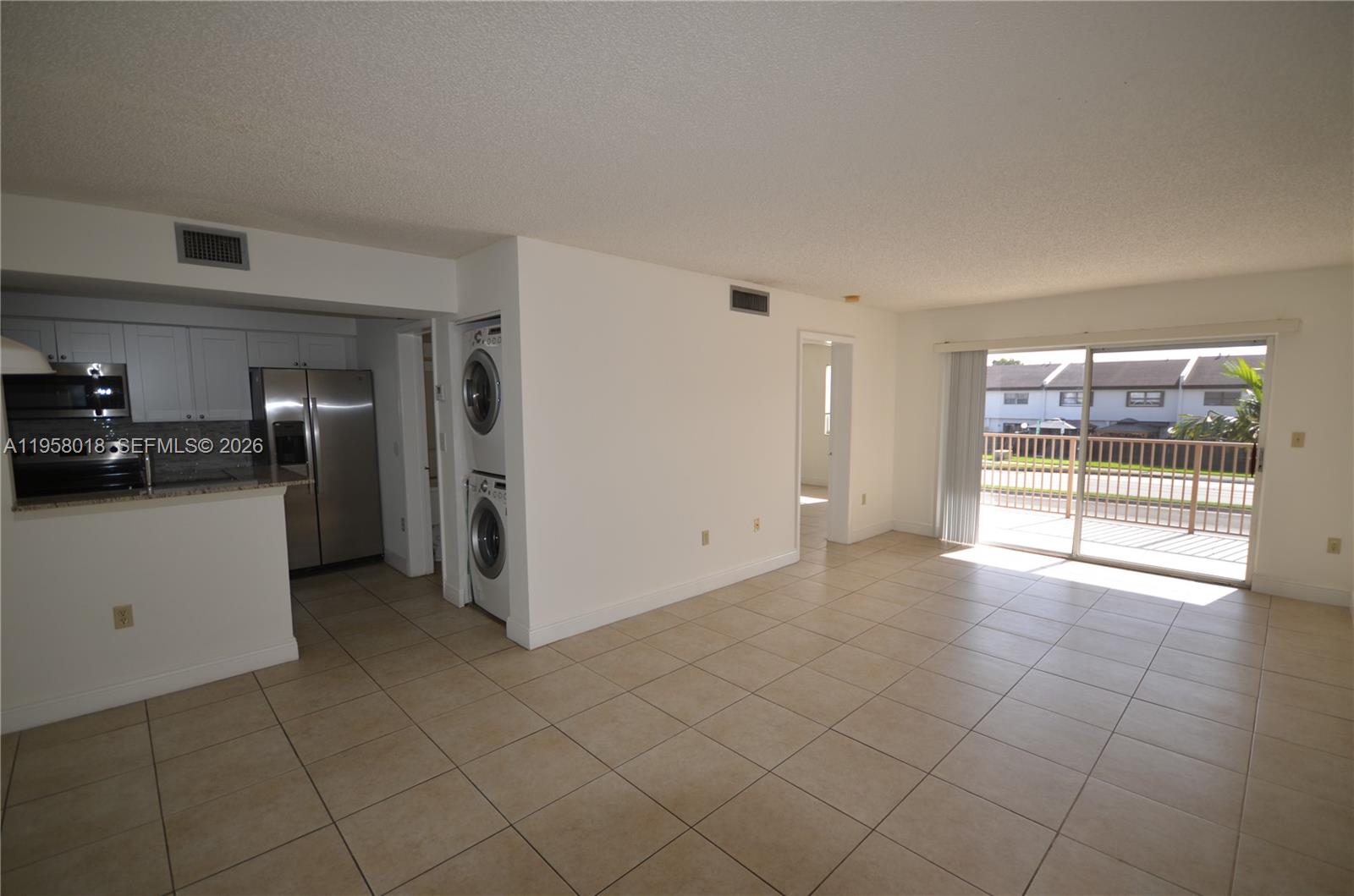 The unit comes fully equipped with modern amenities, including a refrigerator, microwave, dishwasher, oven, AC and washer/dryer.