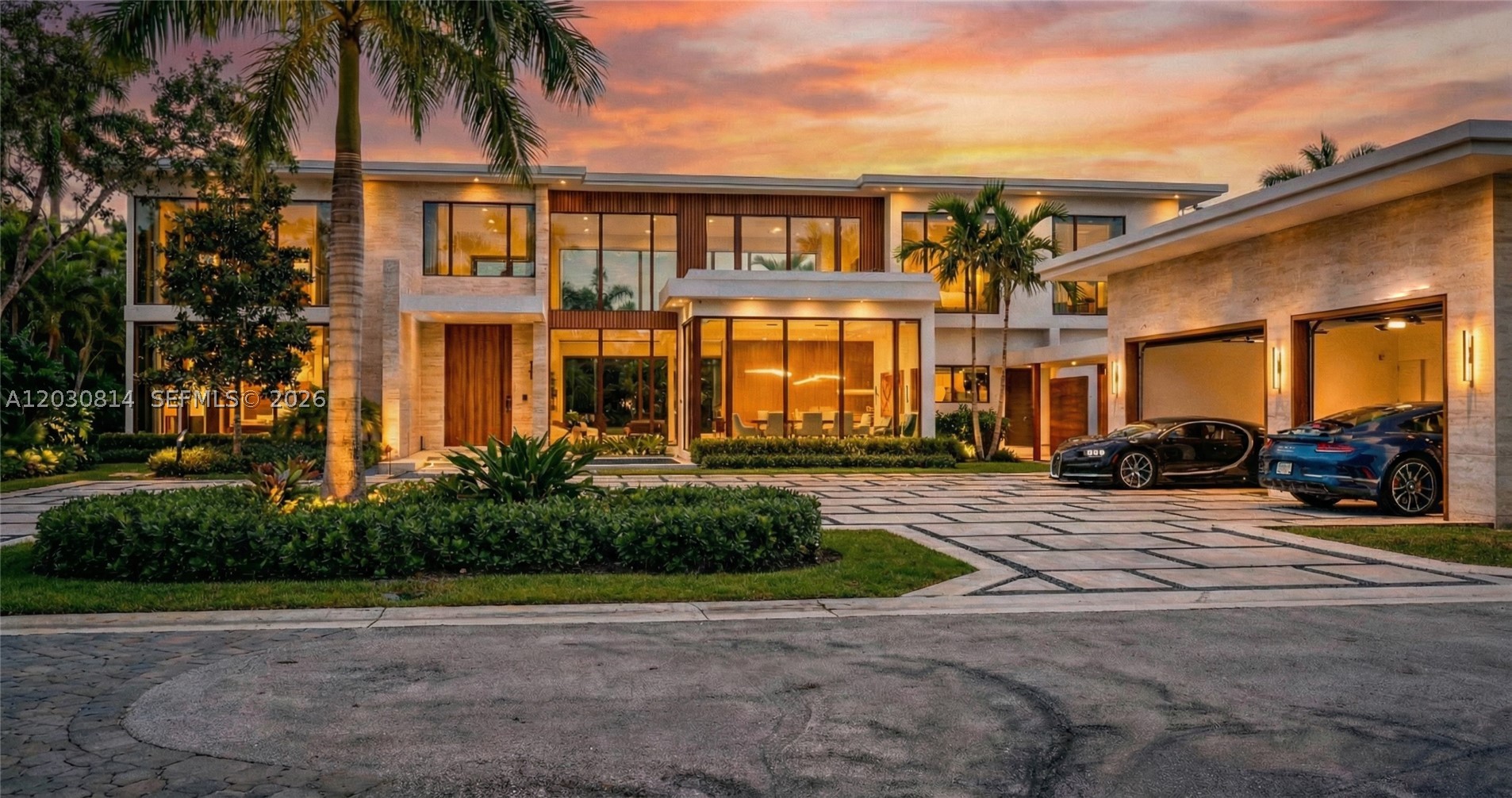 Set on Pinecrest’s most coveted street, West Suburban, this gated Hollub Group and Locus Architecture masterpiece represents the pinnacle of Florida modern living. Positioned on an oversized 40,016 SF lot and accented with warm stone and wood cladding, a striking fountain entry sets the tone for a residence where dramatic design meets refined comfort.
A serene courtyard anchors the home’s effortless flow. The chef’s kitchen features Gaggenau appliances and Italian Cesar cabinetry, complemented by a fully equipped prep kitchen for seamless entertaining. The clubroom is its own destination—custom bar, wine storage, fireplace, and built-ins—while every finish reflects true no-expense-spared craftsmanship.
The primary suite is conveniently located downstairs, creating a private sanctuary of comfort and style. A sculptural  floating staircase leads to additional private suites and a game loft/family room, with each bedroom offering spacious walk-in closets. Two full laundry rooms enhance everyday ease.
Completing the estate is a rare combination of resort-level amenities: a Wellness Center with spa, steam and sauna—balancing entertainment, retreat, and well-being. 
A comprehensive Lutron system seamlessly integrates lighting, climate, shading, and security.
Outdoor living is equally exceptional with a dramatic pool, covered terrace with electric screens, and a fully equipped summer kitchen and generator. Completion: Spring 2027.
