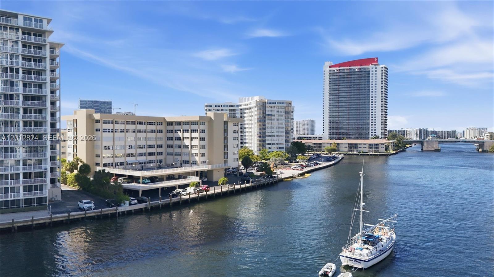 Experience boutique waterfront living at its finest in prestigious Golden Isles. RARE top-floor 1BD/1BA residence offering unmatched privacy with no neighbors above and some of the best Intracoastal, skyline, and distant ocean views in the entire building. This is the largest 1-bedroom model in the community with approximately 950 SF of bright and spacious living, while most other 1-bedroom units are significantly smaller, tile floors and vinyl wood flooring, this layout features high ceilings, abundant natural light, and tranquil water views from both the living area and bedroom. Vacant, unfurnished, and move-in ready. Enjoy peaceful sunsets and the exclusive feel that only a top-floor waterfront residence can provide. Boutique gated community offers heated pool overlooking the Intracoastal, BBQ area, dockage available (subject to approval), covered parking, secure entry, and well-maintained grounds. Prime Hallandale Beach location just minutes from the beach, Gulfstream Park, Aventura Mall, fine dining, luxury shopping, casinos, airports, and vibrant nightlife. Ideal as a primary residence, vacation home, or investment opportunity. "Seller paid $10K assessment already, no more assessments".