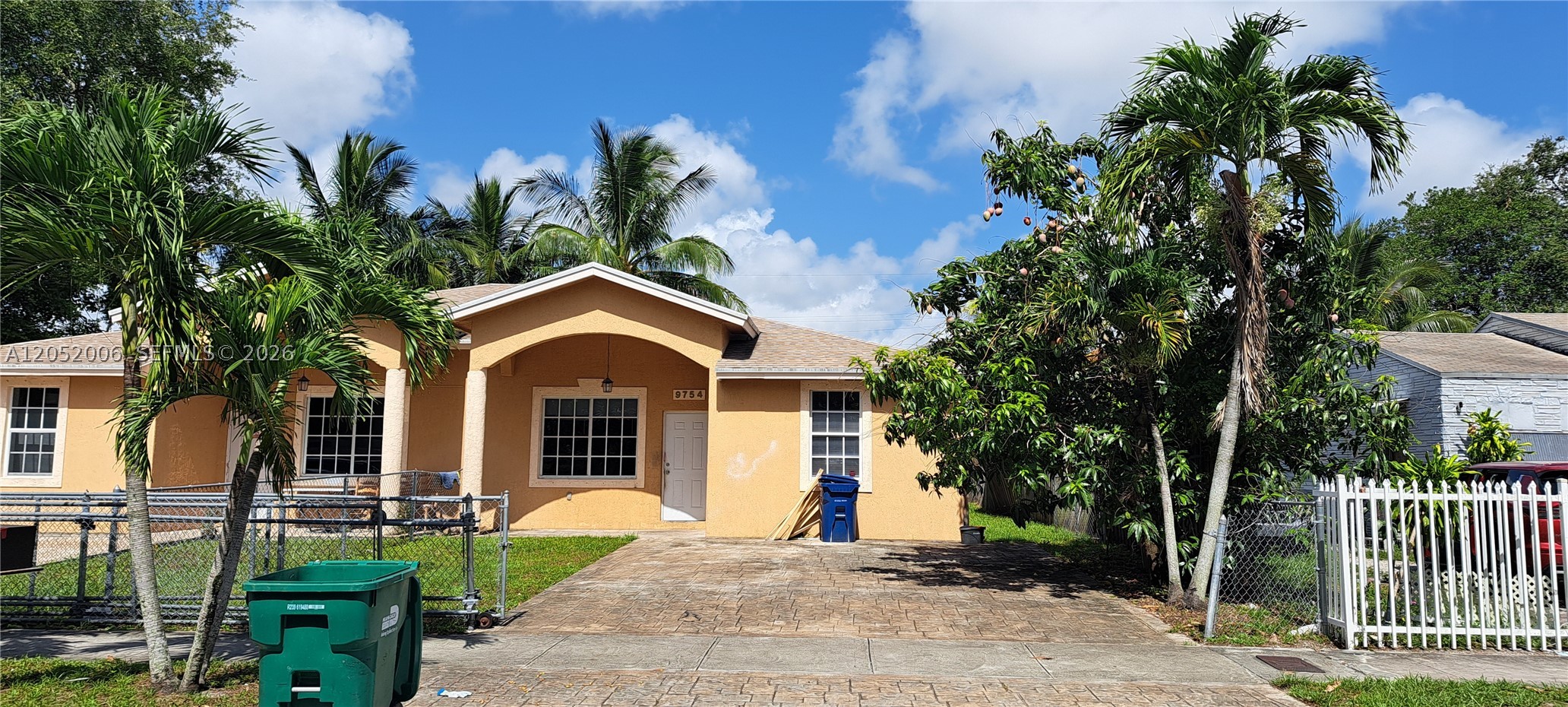 Roomy 3BR/2BA duplex featuring a spacious fenced yard with a mango tree — plenty of room to start your own garden. Ceramic tile flooring runs throughout, complemented by high ceilings and crown molding for an elegant touch. Washer and dryer are included. Conveniently located near major highways and Miami International Airport, this home offers easy access to everywhere you need to go. Pets considered on a breed-by-breed basis with landlord approval. Annual lease only — available now. Easy to show! This unit will be freshly painted and a new refrigerator installed. This rental application cost is 50 dollars per adult tenant.