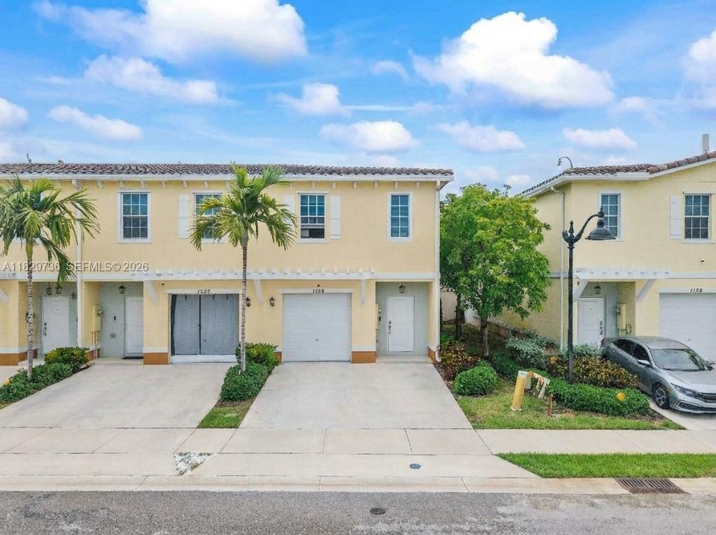 Newly Constructed Townhome Built By DR Horton In 2019. This Beautiful 3 Bed /2.5 Bath Corner Unit With Garage Is Situated On A Peaceful Private Street! This Home Features An Open Floor Plan With Over 1700 Sq Ft. Upgraded Kitchen With Granite Counters, Stainless Steel Appliances. Lots of Cabinet Space And A Pantry. Tile Floors. Full Size Washer/ Dryer.  Screened Patio. 1-Car Garage Plus 2 Parking Spaces. Full Hurricane Protection. This Gated Community Has A Pool, Clubhouse, Children Playground & More. Low HOA Fee Only $197 Per Month. FHA/VA APPROVED! PRIME LOCATION: Walk to Lauderhill Mall, Central Broward Regional Park, Water Park. Live Next To America's ONLY ICC-Certified International Cricket Stadium! T20 World Cup 2024 Was Played Here.  Great For An Owner Or Investor! Can Lease Right Away!! Corner Units Rarely Available! Schedule Your Tour Today!