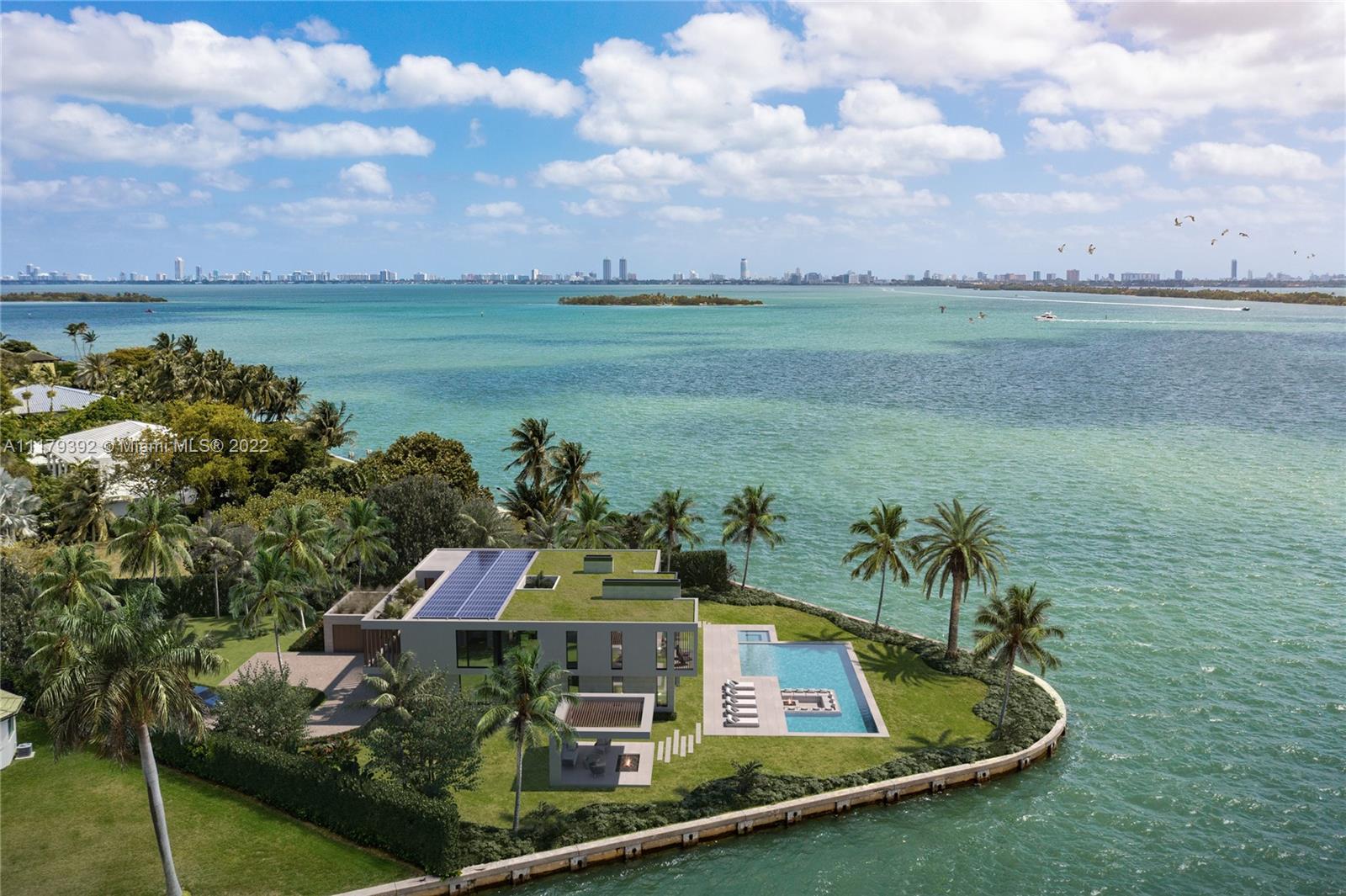Live in the desirable guard-gated Bay Point with some of the most breathtaking views in the entire city. Located at the end of a cul-de-sac, this corner point lot boasts 33,977 SF w/ an impressive 273’ on the water offering a unique angle of sparkling skyline views, sunsets & wide open Biscayne Bay views w/ beautiful sunrises. Build your dream home or renovate to perfection. Enter through private gates to a circular driveway that leads to a 4 bedroom, 4,694 SF residence w/ a one-of-a-kind wraparound living room maximizing the home’s incredible views. Renovations include floor-to-ceiling windows, gourmet chef’s kitchen, glass wine cellar, marble bathrooms & a fireplace. The outdoors are perfect for entertaining with a summer kitchen, sparkling pool w/ a spa & endless views.