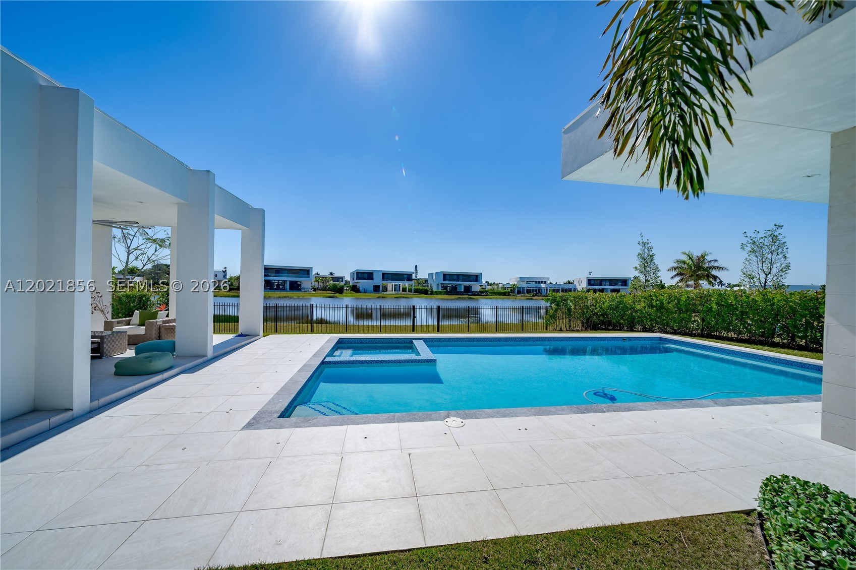 A rare Oppenheim-designed lakefront residence in Botaniko Weston, set on one of the community’s most coveted waterfront lots. This single-story architectural estate captures uninterrupted water views across 27,127 sq. ft. of land, offering 5,184 sq. ft. of refined modern living with 6 bedrooms, 7.5 baths, and a detached 3-car garage.
Walls of glass, soaring ceilings, and seamless indoor-outdoor flow define the experience, with natural light as a constant design element throughout the home.