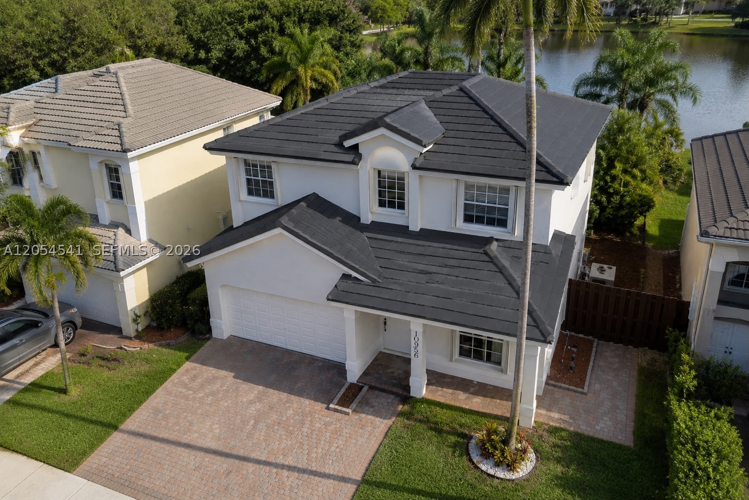 Spectacular waterfront home in Doral available for rent! Bring your most discerning tenants to discover this pristine, move-in-ready gem that has everything to win them over. Featuring incredible curb appeal with a modern dark-tile roof and an elegant paved driveway, this property is sure to make a spectacular first impression. Inside, they will love the bright, open-concept layout beautifully complemented by contemporary grey flooring throughout. The kitchen is a major highlight: fully equipped with premium granite countertops, white cabinetry, a beautiful glass-door display, and stainless steel appliances. You will be captivated by the relaxing outdoor space and serene water views. Located in a highly desirable Doral neighborhood. Very easy to show—schedule your private tour today and secure the perfect rental