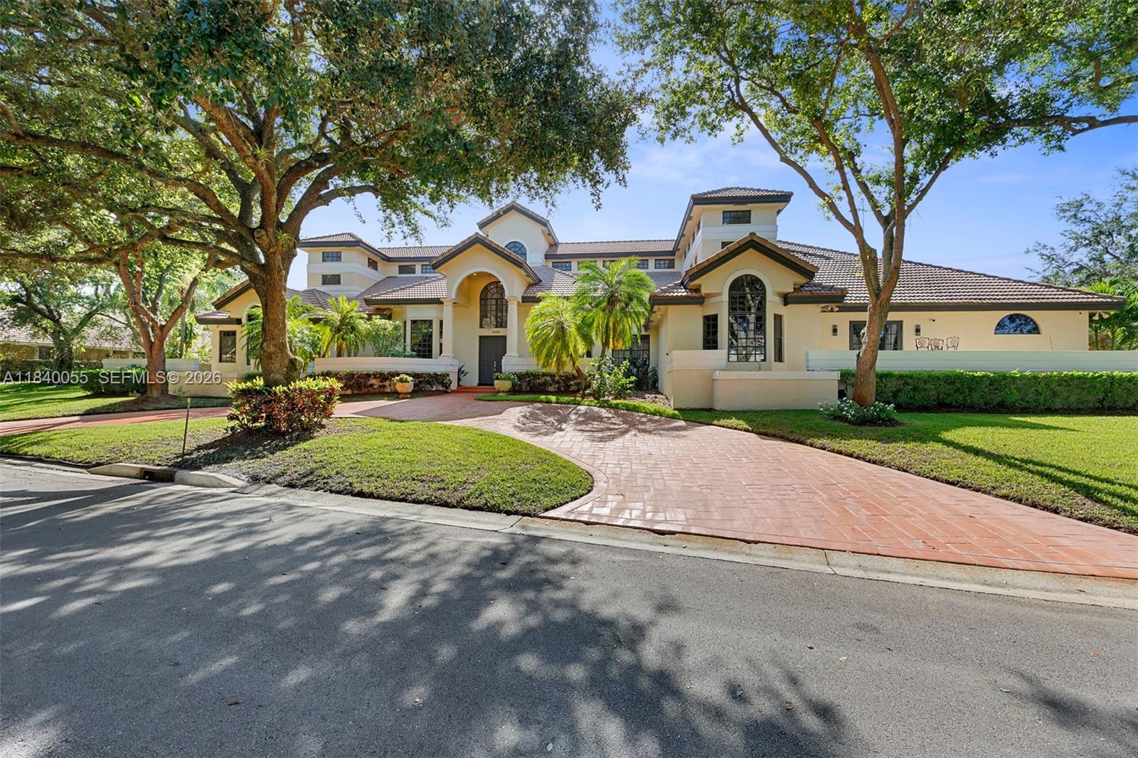 BRAND NEW ROOF – DECEMBER 2025. Experience one of Eagle Trace’s finest estates, ideally positioned within this prestigious gated golf community. Set on nearly an acre, this 8,000+ sq. ft. residence offers 6 bedrooms, 9 baths, and a 3-car garage, combining grand scale with refined elegance. Soaring 30-foot ceilings, marble floors, and abundant natural light create an impressive yet inviting atmosphere throughout. Designed for both everyday living and entertaining, the home features resort-style amenities including a heated pool and spa, sauna, steam shower, fireplace, and wet bar. A dramatic foyer with sweeping staircase opens to expansive living areas and a chef’s kitchen with granite countertops, oversized island, and Jenn-Air appliances. An upstairs loft provides the perfect space for a game room or media lounge.The grand primary suite is a true retreat with serene pool views, custom walk-in closets, and a spa-inspired bath with Jacuzzi tub, dual vanities, bidet, and separate shower. Circular driveway and ample parking enhance convenience and curb appeal.Located in the exclusive Eagle Trace Golf Club community, residents enjoy access to a championship 18-hole golf course designed by Ron Garl, lushly landscaped fairways, a stunning clubhouse, practice facilities, tennis courts, and an active social calendar. This rare estate offers luxury, privacy, and the ultimate South Florida golf lifestyle.