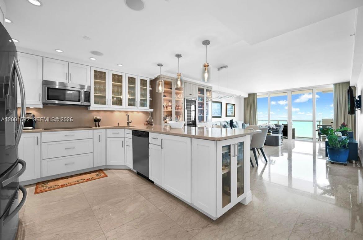 This beautiful ocean view condo offers the perfect balance of style, comfort, and convenience. This home has undergone extensive renovations, over $150,000 in upgrades, making it a must-see! This unit features impact windows, elegant travertine flooring throughout, and a renovated kitchen with quartz countertops. The electrical system has also been upgraded to ensure safety and efficiency. The building has passed its 40-year certification and has had recent renovations like new elevators and refreshed hallways. Enjoy direct beach access, a gym, heated pool, perfect for staying active or relaxing in style. Short term rentals such as Airbnb and VRBO are permitted, making this a great investment opportunity. This home is an ideal choice for both vacation homeowners and investors alike.