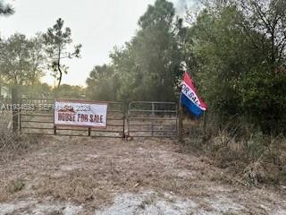 Build your dream in the desirable Montura Ranch community with no HOA, surrounded by established homes. Just minutes from Lake Okeechobee and Clewiston–Airglades Airport, this 1.25-acre lot offers serene seclusion on a quiet dirt road—mostly cleared with mature trees and privately fenced. Ideal for a custom home, mobile home, or weekend getaway. Flexible use allows for farm animals, hobby farming, or peaceful country living. Enjoy wide-open spaces and a relaxed rural lifestyle, just 90 miles from Miami.