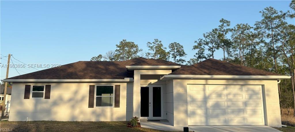 This stunning 3-bedroom, 2-bath home in a quiet Lehigh Acres neighborhood offers modern comfort and style. The open-concept living space features elegant quartz countertops and stainless-steel appliances, including refrigerator/freezer, range, dishwasher, and microwave. Both bathrooms are finished with contemporary, high-quality touches, and the spacious 2-car garage provides ample room for parking and storage. Built with attention to detail, this home delivers privacy, quality, and comfort, ready for you to move in and enjoy.