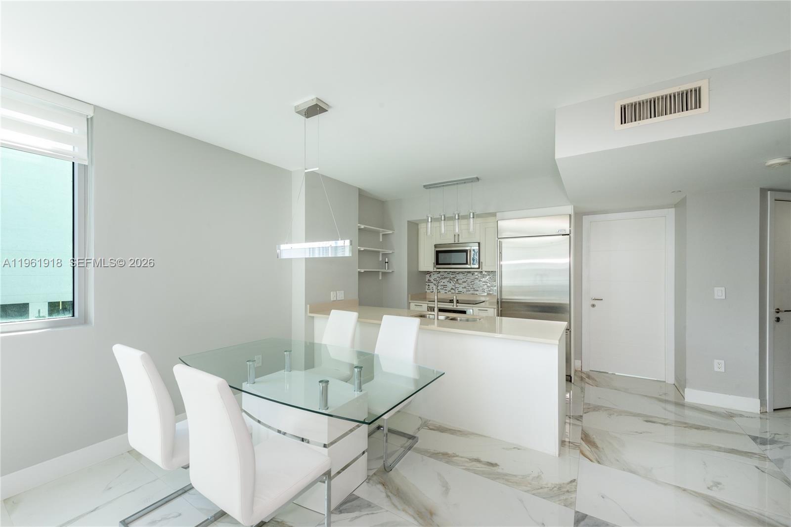 Beautiful and well-maintained 2 Bed / 2 Bath residence at desirable 500 Brickell Condo. This unit features elegant porcelain floors throughout, a European-style kitchen with wood cabinetry and stainless steel appliances, marble bathrooms, and a private balcony with stunning city views. Furniture may be included in the sales price if desired. Amenities at 500 Brickell West include a state-of-the-art fitness center, an 11th-floor pool and sundeck with private cabanas, sauna and steam rooms, whirlpool tubs, a sports room with billiards, a kitchen, a clubroom, a wine cellar, a theater room, 24-hour concierge and security services, and 24-hour valet parking. Residents also enjoy access to the rooftop pool and sundeck located in the East Tower. 1 assigned parking space (#5106).  Complimentary basic cable and internet provided by Hotwire.