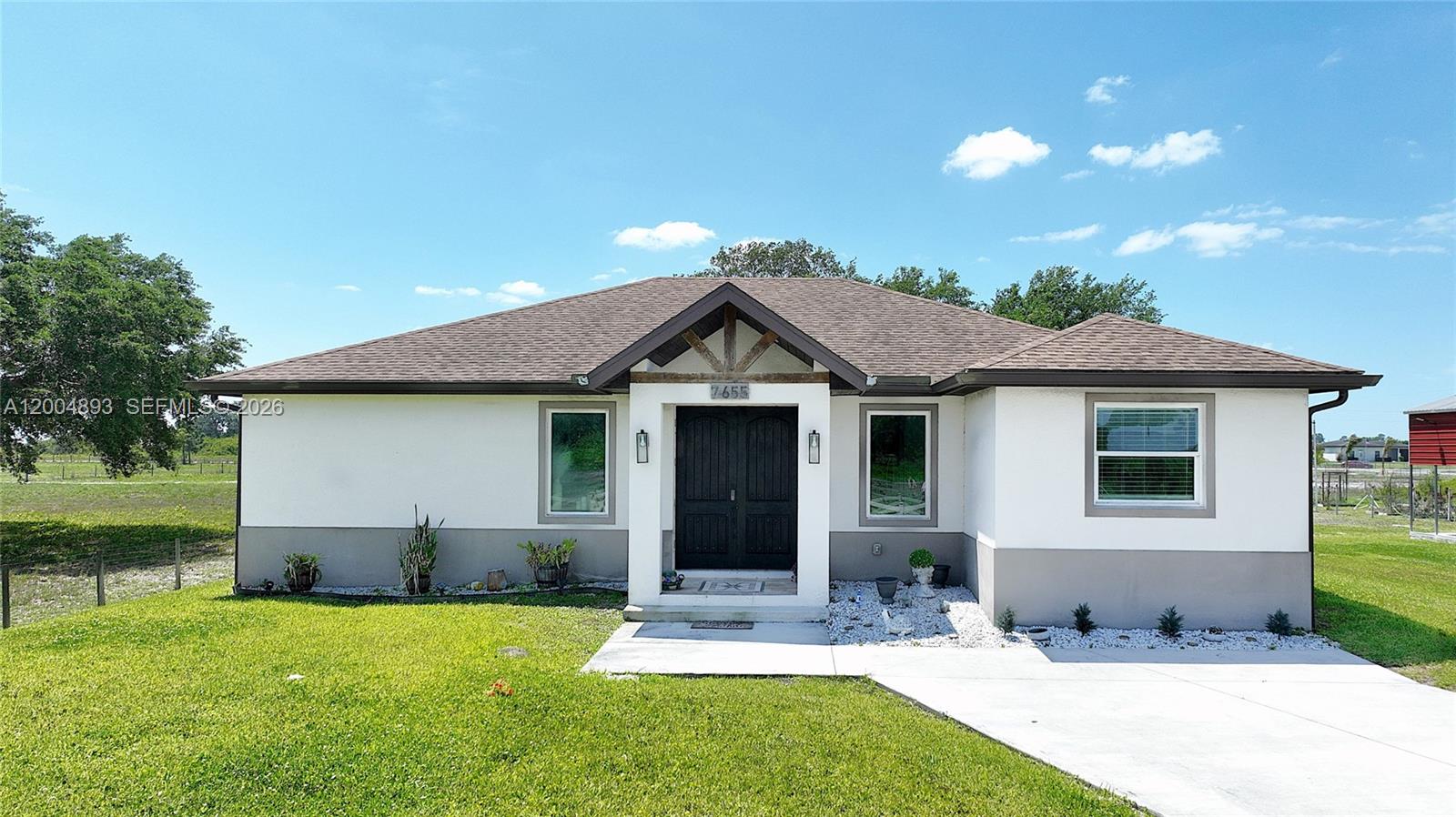 Wheeler subdivision!  The single family home has 3 bedrooms, 2 bathrooms, and a large detached 3 car garage or workshop with electric. The interior features granite counters, stainless steel appliances, and beautiful tile flooring throughout. Step outside to the screened lanai with a built-in grill and convenient half bath, perfect for entertaining guests or enjoying a relaxing evening at home. But the upgrades don't stop there - this property also includes a separate detached RV covered parking with an electric plug-in, and a storage shed for all your outdoor equipment. Whether you're a car enthusiast, DIYer, or just looking for extra space to store your toys.This home on 1.25 acres has it all. It has all the amenities you could ever want and bring your farm animals. Schedule a showing today and make this house yours forever.