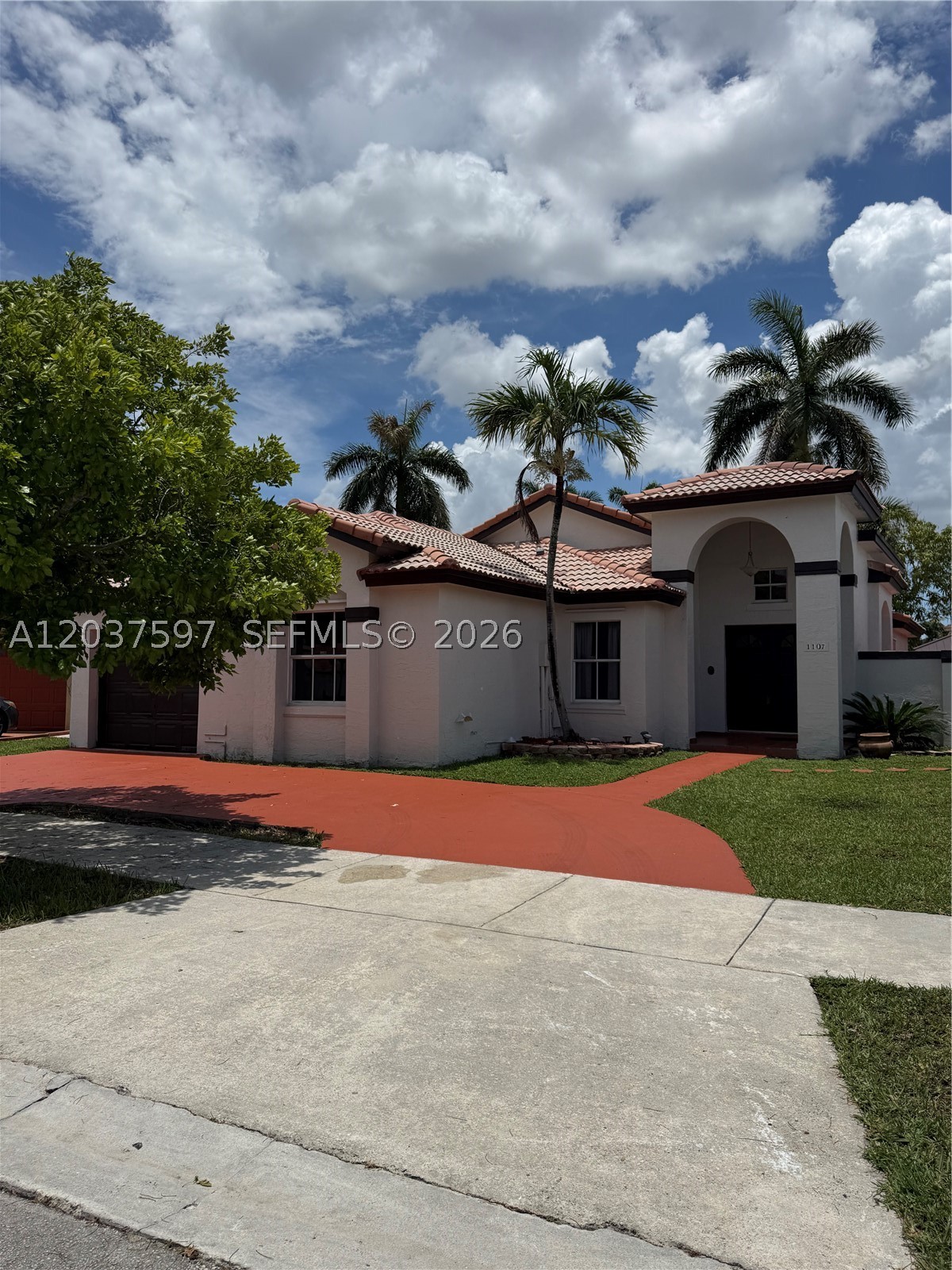 Beautiful and spacious one-story home with 3 bedrooms, 2 bathrooms, and a 1-car garage. This light-filled residence features high ceilings, tile flooring throughout, and an updated kitchen with new cabinets and quartz countertops. Enjoy an open and airy layout perfect for comfortable living and entertaining. Ideally located near the Florida Turnpike, Dolphin Mall, shopping, dining, and major roadways. No HOA! Move-in ready.