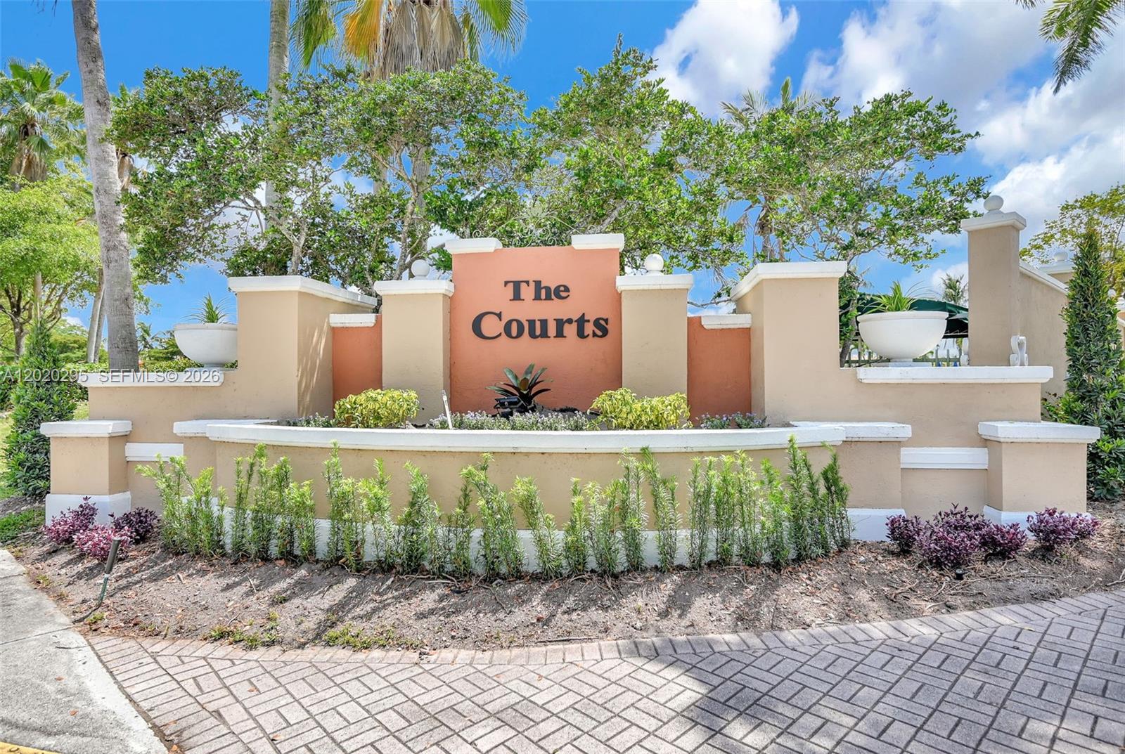 Impeccable 3BD/2BA residence located in the highly desirable gated community of The Courts at Doral Isles! This move-in ready unit features an open floor plan filled with abundant natural light, vinyl flooring throughout, and new stackable washer & dryer. Enjoy 2 assigned parking spaces plus plenty of guest parking. Well-maintained community with 24/7 security, pool, exercise room, playground, and beautiful lake views. New building roof has recently been completed and no special assessments. Conveniently located near top-rated Doral schools, parks, shopping malls, supermarkets, bus stops, Miami International Airport, and with quick access to I-75, Palmetto Expressway, and 836. A true pride of ownership, easy to show and ready for its next owner. Schedule your private showing today!