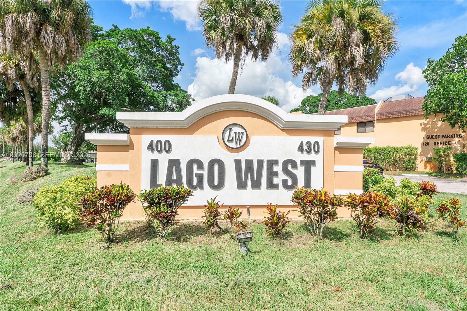 Come and see this light & bright, immaculate & spacious, 2 Bedroom 2 Full Bath second floor condo unit in popular Lago West in Plantation! Nestled within a gated community with no age restrictions, this unit invites you in with a lovely garden view, perfect for first time home buyers! The kitchen has warm wood cabinets with granite countertops and stainless-steel appliances with your own full-size washer & dryer. You will love the wood look tile flooring throughout the great room living area and bedrooms! Features Include: Updated master bathroom vanity area with new cabinet, lights, mirror, medicine chest. Updated guest bathroom floor, cabinet, lights, mirror, toilet and shower tile, newer A/C, New window & sliding glass door replaced along back over-looking green space and leading to patio. Also, for your protection complete accordion shutters. Enjoy plenty of closet space: walk ins, additional closets and a storage closet on the screened balcony. Amenities Include: a community pool, clubhouse, gym and tennis courts with assigned parking space and plenty of guest parking for visitors. Conveniently located only minutes from Sawgrass Mall, Fort Lauderdale Airport, Arena, grocery, restaurants and highways. Easy access to 595, 75 and Sawgrass Expwy.