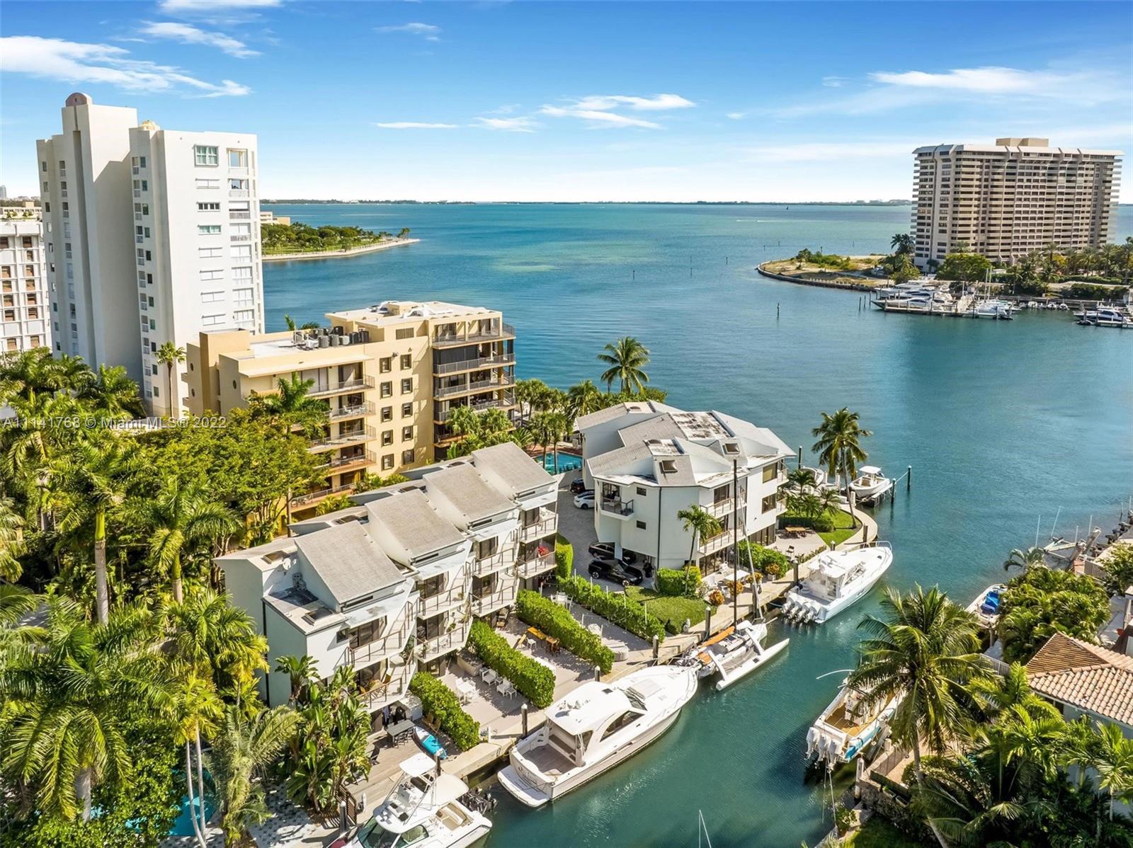 Beautiful, remodeled town home on the water. This lovely town home with 2 bedroom 3.5 bathrooms spectacular unobstructed views too bay. Your own 40' dock right behind your unit, property has impact doors and windows, All stainless appliances with wine fridge, Venetian plaster ceilings in the heart of coconut grove. Balconies in front and in the rear for great views. 2 Car covered parking in front of unit. No bridges to bay for boat lovers. Gated entrance to an only 8-unit complex with a community pool.