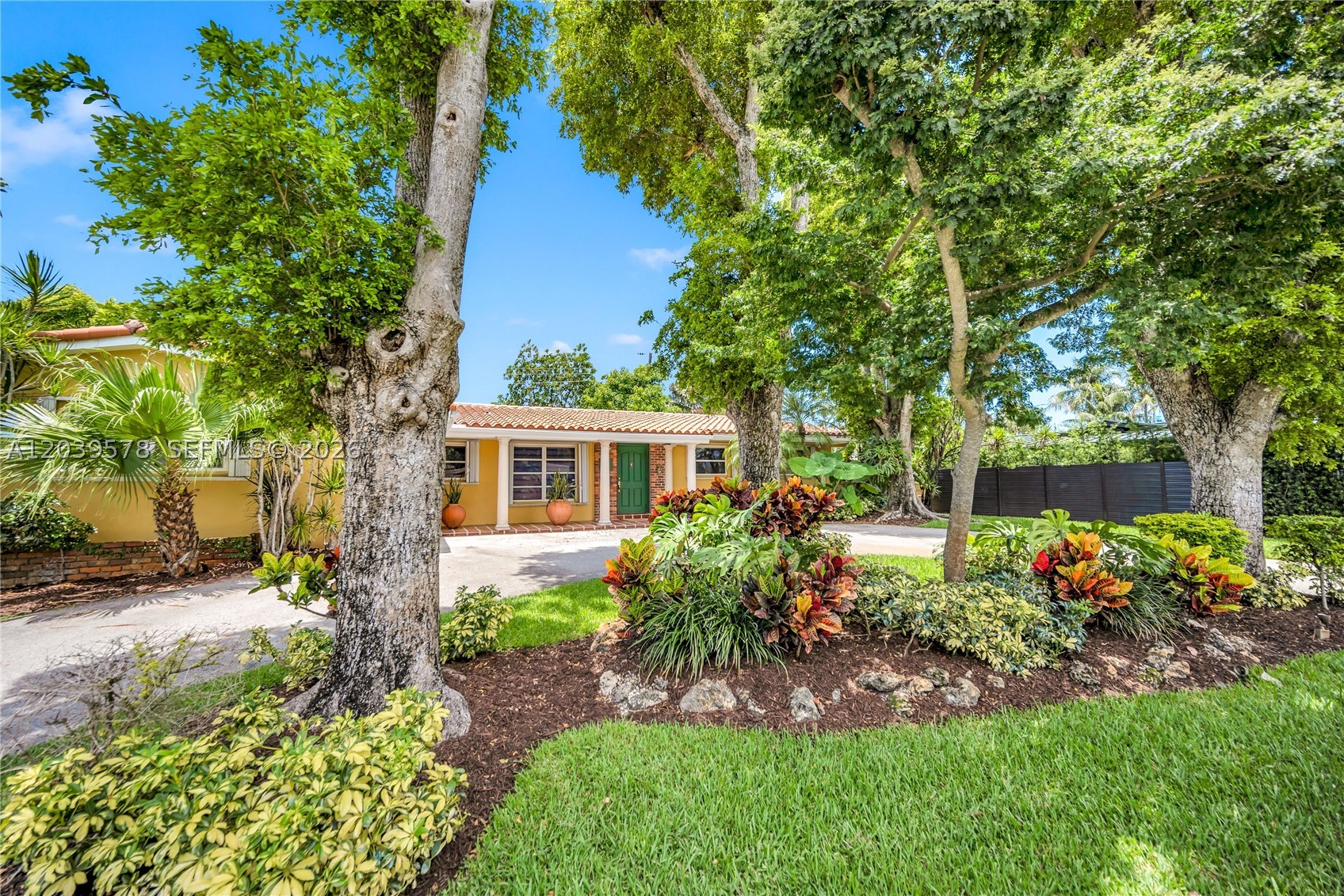 Discover this charming ranch-style home in the sought-after Baptist Hospital neighborhood of East Kendall. Upon arrival, you're welcomed by mature landscaping & an inviting front porch. Inside, an open floor plan features spacious living & dining areas overlooking the private backyard. Offering 4 bedrooms plus an office/den that can easily be converted into a 5th bedroom, this home provides flexibility to suit a variety of lifestyles. The split floor plan includes a spacious primary suite with a walk-in closet. The renovated kitchen is appointed with sleek white cabinetry & quartz countertops. Dedicated laundry/utility room & ample closet space throughout. Enjoy outdoor living on your private covered terrace surrounded by tropical landscaping, with multiple entertaining areas & a screened-in patio. Additional features include a new AC (2026), complete hurricane shutters, a circular driveway, city sewer connection (no septic tank!) & a non-flood zone location. Tucked away in a quiet pocket just minutes from Dadeland Mall, Baptist Hospital & top-rated schools, this home offers comfort & convenience in one of Miami's most desirable neighborhoods.