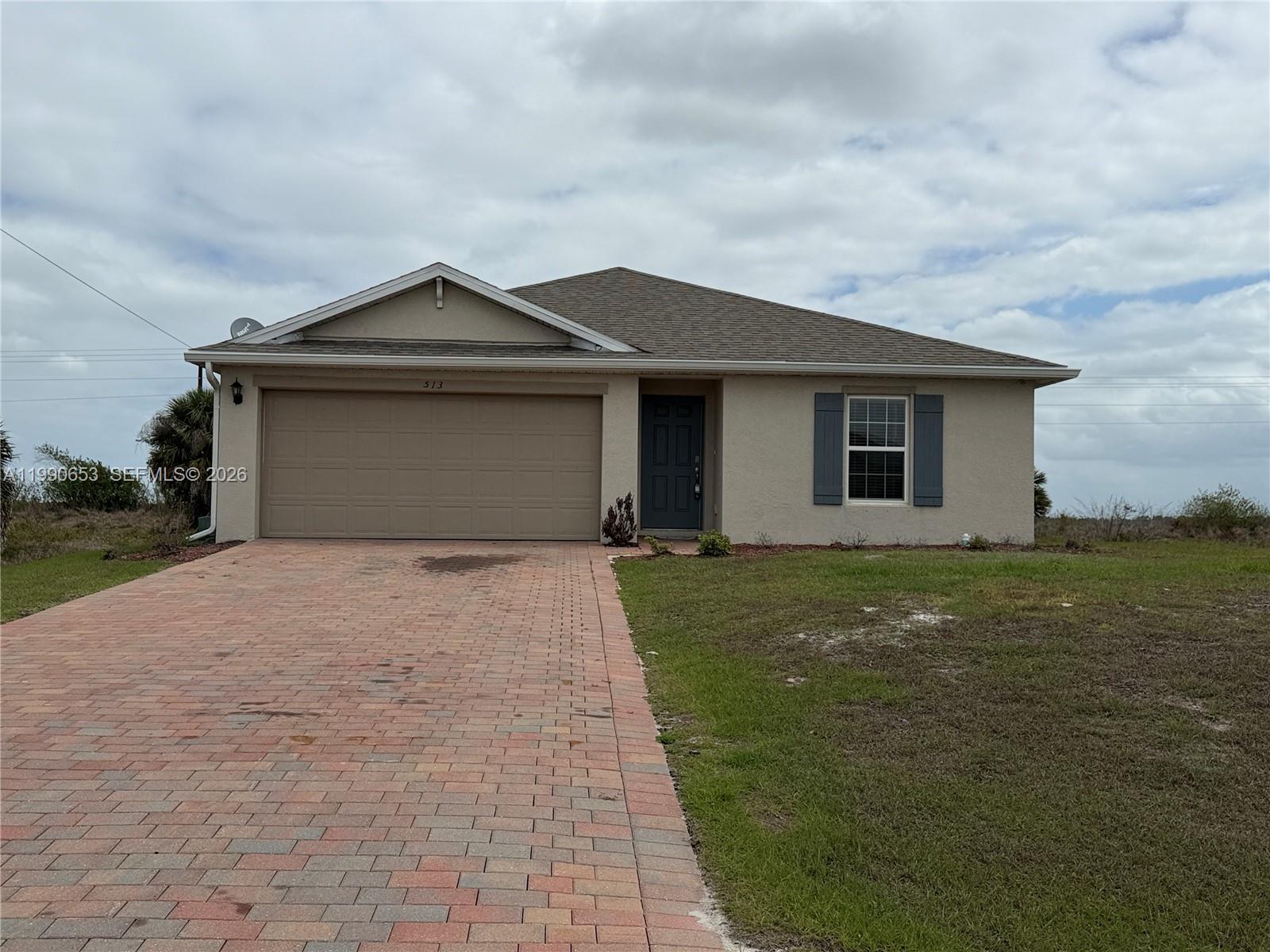 Beautiful 2023-built 4-bedroom, 2-bathroom single-family home located in the desirable Banyan Village community of Port LaBelle. This one-story home features a modern open floor plan with tile flooring in the main living areas, quartz countertops, and a fully equipped kitchen. Enjoy the convenience of a full appliance package, including a washer and dryer, making move-in easy and stress-free. The spacious layout includes a 2-car garage, smart home features, and plenty of natural light throughout. Situated on an oversized lot with room to enjoy outdoor living, this property offers both comfort and convenience. Located in a growing area with no HOA restrictions, this home is perfect for those seeking peaceful Florida living. QUICK 3-DAY approval process and available for immediate move-in!