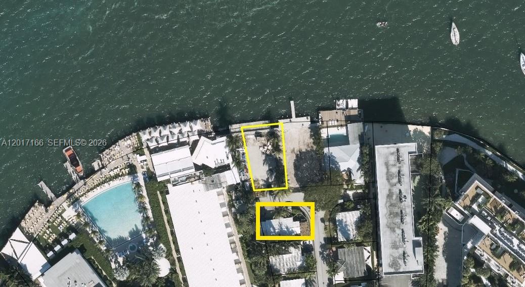 This combined property offers a rare opportunity to develop your vision and luxury home on Belle Isle's exclusive
Farrey Lane. Over 7,300 SF of land with open views to Biscayne Bay and city with 50 FT of waterfront and a large private dock. As per owner, approved plans to build a 9,125 SF luxury 3-story single-family home with a rooftop terrace & bay view. The property is in an amazing central location next door to The Standard Hotel, and just a short distance to Sunset Harbour, Lincoln Road, fine dining, shops, South Beach, downtown Miami, cultural & sport venues, and MIA airport. Exceptional opportunity to develop a luxury waterfront home in a highly sought-after location! Owners will not sell the Properties separately.