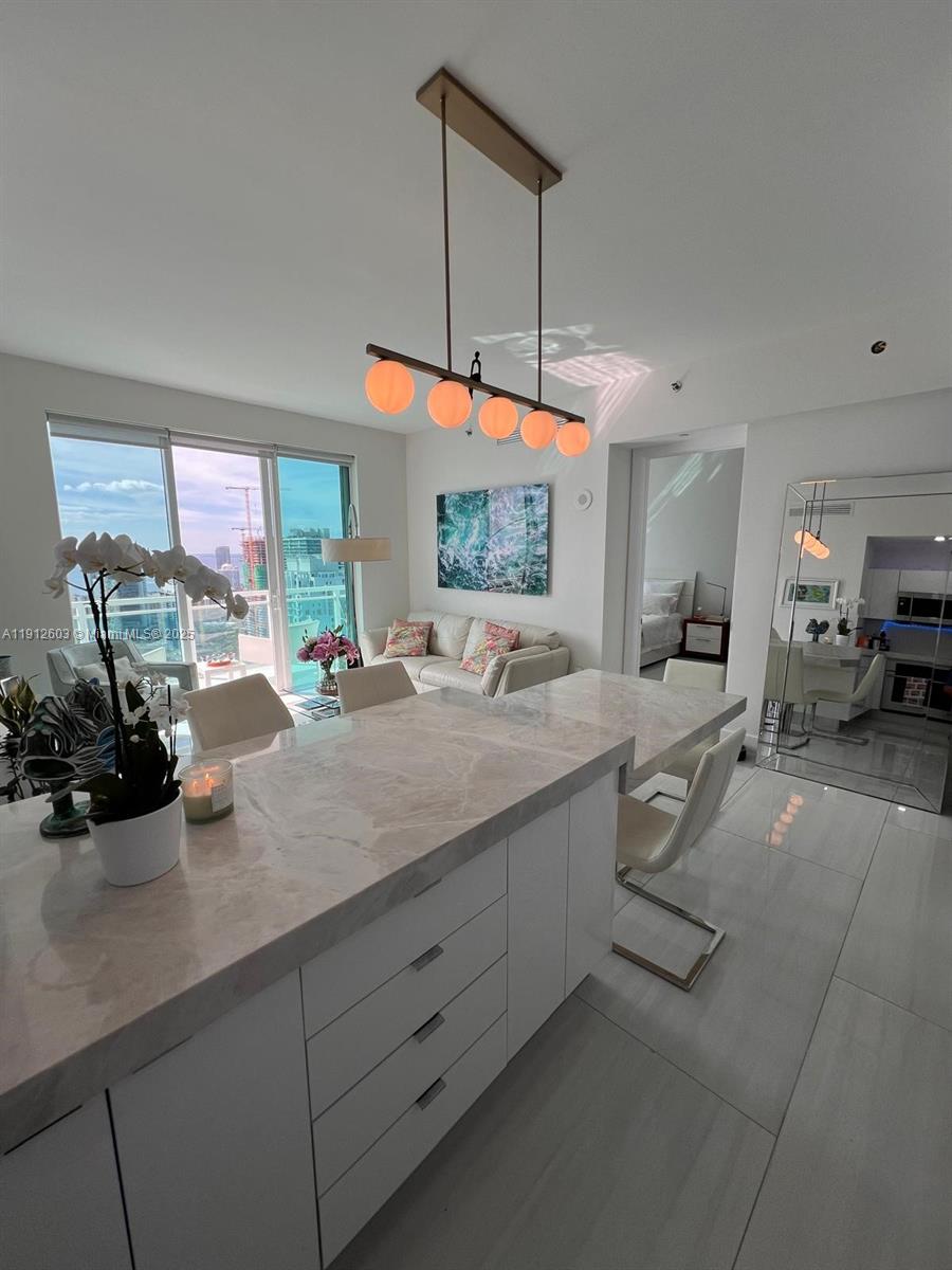 Beautiful, two bedroom two bathroom apartment with breathtaking views over Biscayne Bay. Impeccably renovated throughout with top-tier finishes and appliances. Natural quartzite stone kitchen counter tops with high-end appliances and new bathroom hardware and showers. Fully furnished with a sense of calm and happiness to fully enjoy the waterfront distance. Every gorgeous sunset feels magical inj your private oasis-resort-style living at its finest.