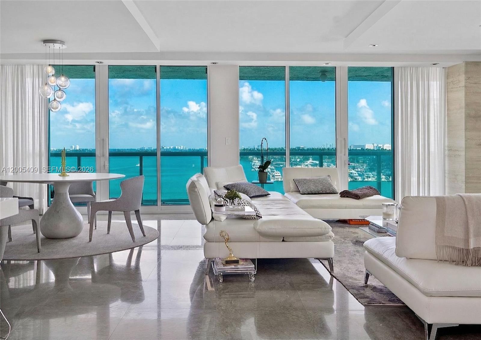 Immerse yourself in luxury living with this exceptional 3-bedroom, 3-bathroom corner unit featuring 2,327 square feet of refined interiors. This spacious home offers an abundance of natural light and panoramic views, best enjoyed from one of two wraparaound overisized balconies, offering views to the north, south, east and west.

The open floor plan is accentuated by elegant stone floors, recessed lighting, and chandeliers, creating a perfect balance of sophistication and warmth. The views continue from the open kitchen with breakfast bar, ideal for both casual dining and entertaining. Copious storage is provided with custom and walk-in closets, while the primary ensuite bathroom delights with a separate soaking tub, shower, and double sinks framed in luxurious marble.

Enjoy access to premium amenities, including a heated pool, hot tub, spa, and barbecue area—perfect for relaxing or hosting gatherings. Additional conveniences include a gym, tennis court, common media/recreation room, concierge services, and security staff for your peace of mind. Three (3) assigned parking, a garage, guest spaces, and valet options provide ample convenience.

This home epitomizes Miami Beach living with its seamless blend of comfort, style, and outstanding community features. With its sought-after location - walkable to EVERYTHING - and sophisticated design, this 3 bedroom apartment is a rarity. Schedule a private tour today and experience true luxury living on Belle Isle.