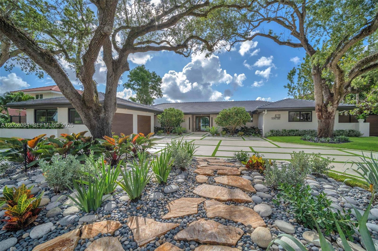 Where the Fairway Meets the Finest Stone.

Tucked away on a quiet Emerald Hills cul-de-sac, 4220 Casper Court is a striking golf course estate offering 5,000 sq ft, 6 bedrooms, and 5 bathrooms. Set directly on the fairway, the home welcomes you with sweeping views of manicured greens and a shimmering lake from the moment you enter.

Throughout the residence, Crystallo, Taj Mahal quartzite, Viola marble, and striking onyx accents add warmth, richness, and sophistication. The chef’s kitchen is anchored by a dramatic Taj Mahal quartzite island and appointed with chef-caliber appliances and top-tier coffee station. Impact glass fills the living spaces with natural light while showcasing breathtaking golf course and lake views.

Outside, a private resort-style retreat awaits with a leathered marble pool deck, 10-person champagne spa, and wood-clad pergola with a full outdoor kitchen, surrounded by lush landscaping for entertaining.

The primary suite offers a serene escape featuring rich Viola marble, a sculptural freestanding tub, and luxurious steam shower. An all-new tile roof and whole-home natural gas generator add peace of mind.

Ideally located near houses of worship, Fort Lauderdale Airport, the Hard Rock, Hollywood Beach, upscale shopping, and fine dining, this exceptional home blends spectacular views, meticulous design, extraordinary finishes, and South Florida living.

Schedule your private tour. Homes of this caliber almost never become available.