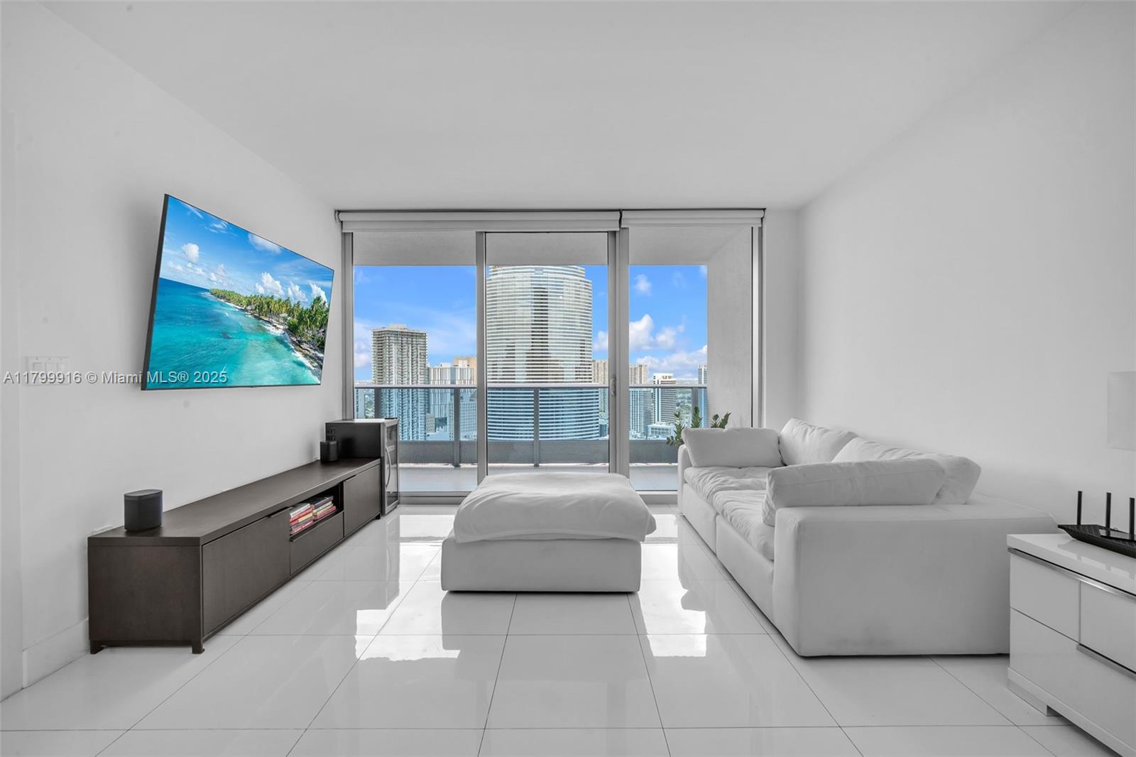 Price improvement on this exceptional opportunity. Experience elevated luxury in this 1-bedroom, 1.5-bath residence on the 40th floor of Epic, one of Miami’s most sought-after addresses. The home features top-tier finishes throughout, including a Snaidero kitchen with Miele appliances, Sub-Zero refrigerator, Italian flooring, marble bathrooms, and custom closets. Enjoy a 178-sq-ft balcony with breathtaking 180° panoramic city views. Residents receive exclusive VIP access to Joia Beach Club, dining discounts at select world-class restaurants, complimentary Silverspot Cinema tickets, spa services, in-room dining, and resort-style pools. Ideally located just steps from Whole Foods and Brickell City Center. Private showings available.