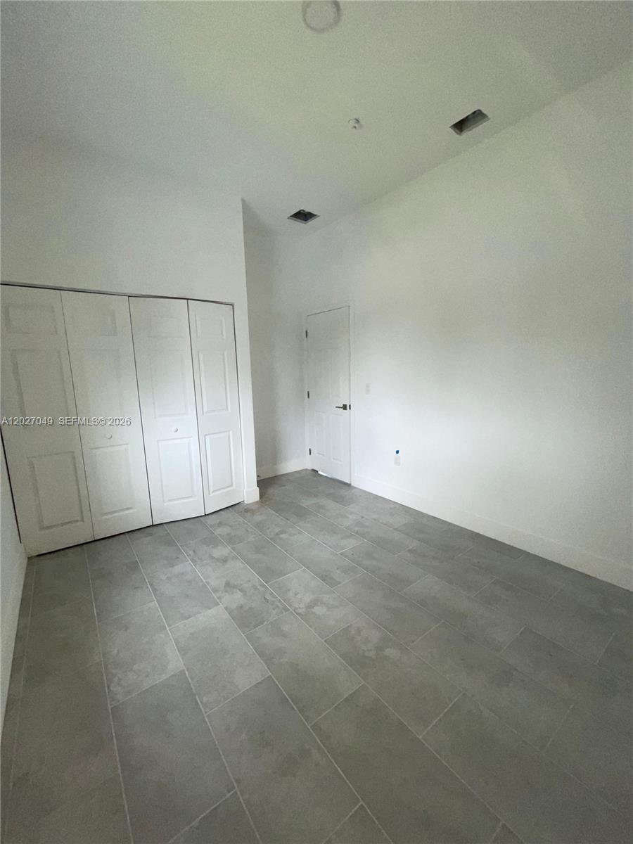 Old Spanish-style home, 3 bedrooms, 2 bathrooms. It is tenant-occupied. The house needs rehab.