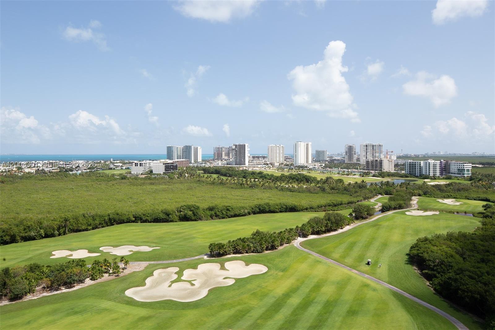 WOHA is situated on the edge of the Puerto Cancun Golf Club, overlooking a natural preserve, the posh Puerto Cancun skyline, and the Caribbean. Like living in an ecological habitat, this development is a marriage of sustainability and design, merging the highest levels of comfort and aesthetics, so you can live the balanced life you've always dreamed of. Solar panels and wind turbines tucked away on the building’s rooftop quietly help power the common areas, reducing the carbon footprint as well as shared energy costs. Water recycling and separation, and rainwater harvesting tanks further reduce costs and environmental impacts. Resort-style amenities make this an amazing place to live. Multi-sectioned swimming pool, fitness center, wellness spa, massage, sauna, co-working lobby, sports lounge, billiards room, kid’s club, mini golf, pet park, and event room provide outlets for your daily routines. Private elevators with biometric access authentication. Hurricane-resistant floor-to-ceiling glass, ample balconies, flow-through design maximizes natural breezes that power the wind turbines on the roof, for efficient cooling of the interiors without the need for a/c. High-efficiency zoned and central a/c, recessed LED lighting, energy-efficient appliances, sound reduction and UV-control windows. Developer employed the finest interior and exterior finishes, from Italian porcelain flooring and closets to cabinets, appliances, hardware and fixtures, lighting and electric.