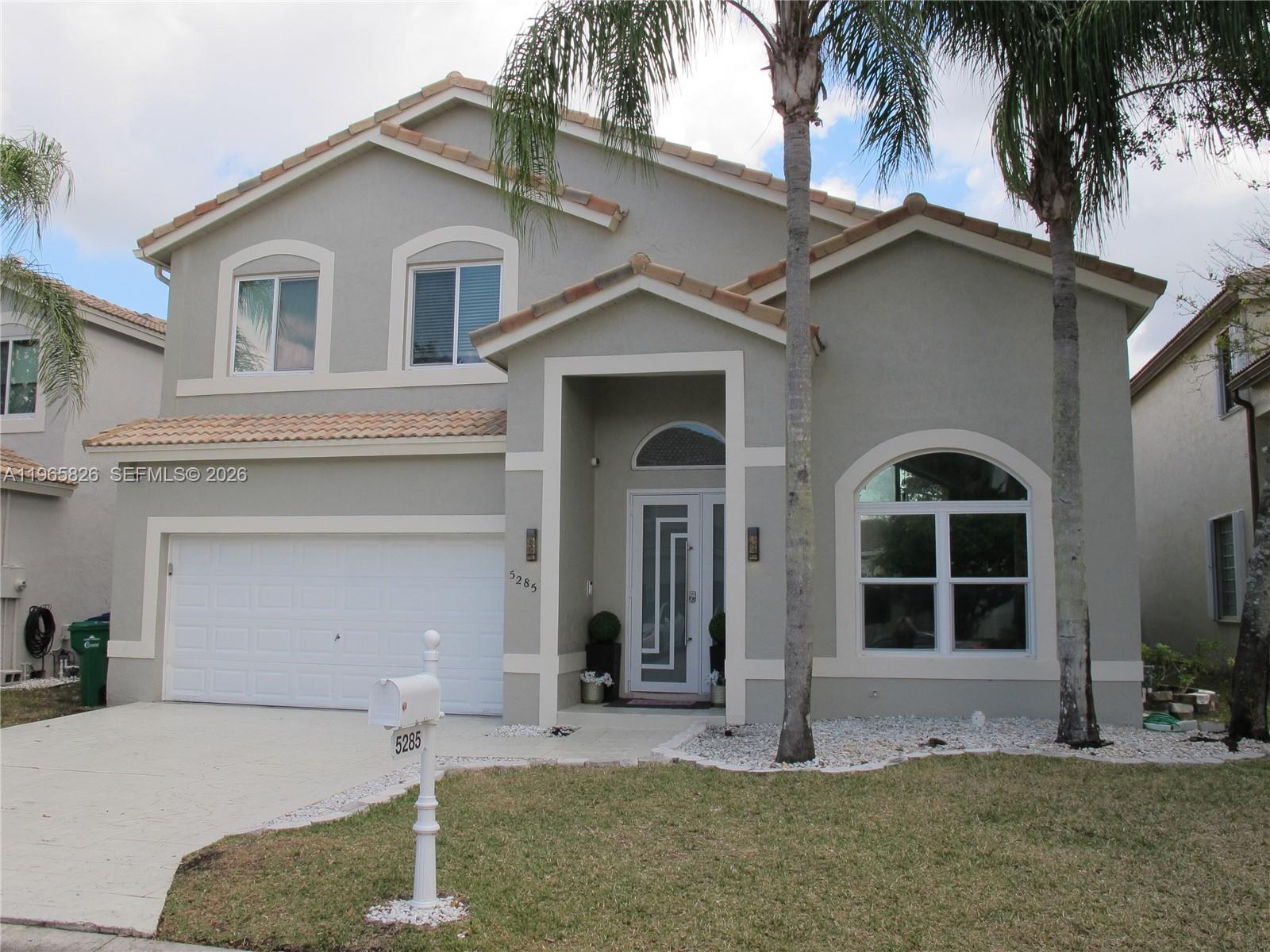 **OPULENCE AT ITS FINEST!** This 5 Bedroom and 3 1/2 bath pool home has an amazing number of upgrades, open concept floorplan, high ceilings, and so much more! **The GOURMET KICTHEN is nothing short of MAGIFICENT!** From the MASSIVE QUARTZ countertop to the seemingly unlimited cabinets and the WiFi enabled SMART refrigerator, you have the ultimate in 21st century elegance! The IMMENSE ISLAND, also with a QUARTZ countertop, is perfect to prepare family meals, entertain, or just sit around with many friends. **Downstairs is the Large Master Suite with a LAVISH EN SUITE BATH and private dressing area.** The massive ALL QUARTZ SHOWER, complete with DOUBLE DOOR GLASS ENCLOSURE, lengthy built-in SHOWER BENCH, and 3 shower heads including a RAIN SHOWER, will make you feel that you are at a luxurious spa retreat!! His/Hers CUSTOM WALK-IN CLOSETS frame the EXTRA LARGE DRESSING AREA.** Upstairs you will find 4 generously sized bedrooms and 2 beautifully UPDATED BATHROOMS, along with an ENORMOUS LOFT which overlooks the entire 1st floor. **NO WORRIES, all this is protected by HURRICANE IMPACT RESISTANT WINDOWS AND DOORS!!** Outside is the IMMENSE screened-in pool/patio area overlooking the quiet and serene lake. Other upgrades include: NEWER A/C, Porcelain Tile Floors, NEWER water heater, New SMART irrigation system, Front load high-end washer/dryer, and FRESHLY PAINTED exterior. The only thing this home needs is YOU!!!