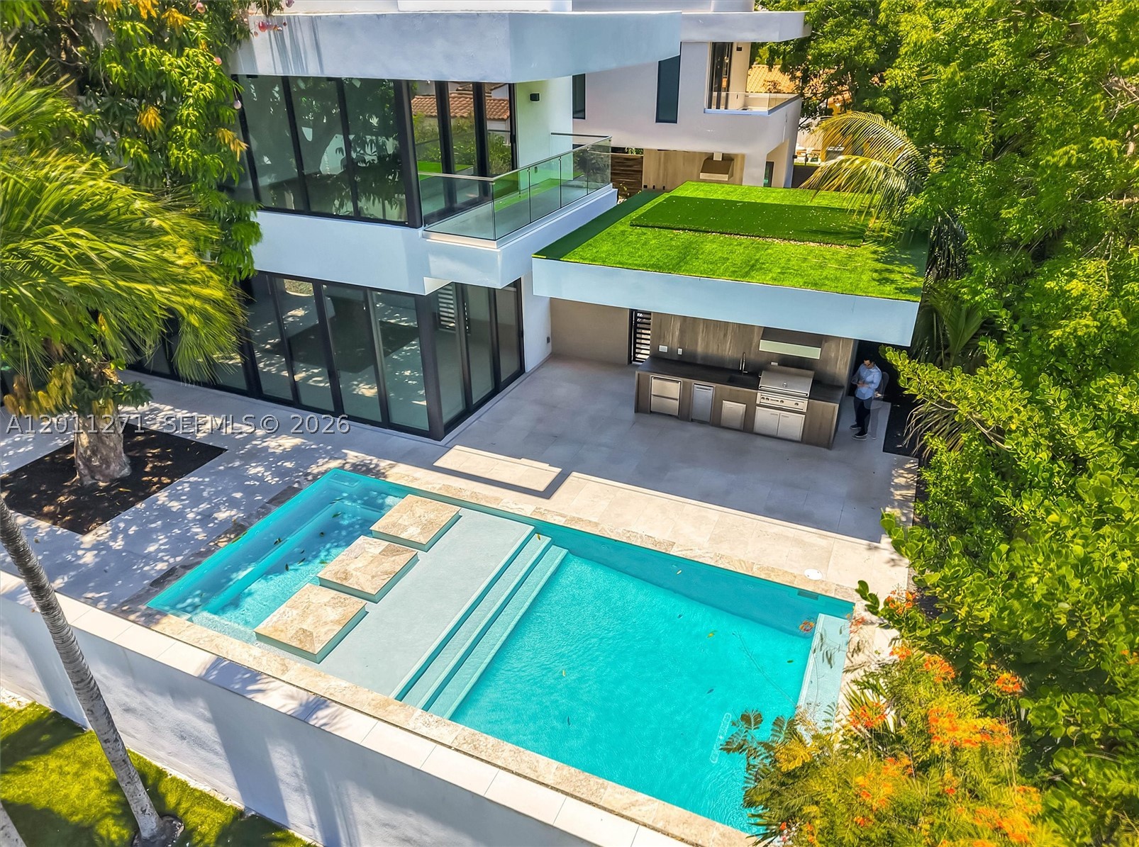 New construction in The Roads near Brickell. This 5 bed, 6.5 bath single-family home features 4,509 SF under A/C (5,461 total SF), plus a maid's/in-law suite. Designed for luxury living with Italian custom kitchen, gym, sauna, and open-concept interiors. Outdoor space includes pool, jacuzzi, summer kitchen with BBQ, full cabana bath, and lush garden with a beautiful mango tree. A perfect blend of comfort and elegance in one of Miami's most desirable neighborhoods.