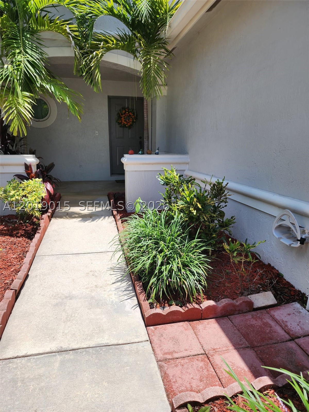 For Sale or Trade! Located in a beautifully maintained gated community, this updated waterfront townhome combines peaceful living with modern comfort. Recent renovations, including brand-new carpeting, fresh interior paint, and other stylish improvements, make this home truly move-in ready. The home has also been professionally cleaned and features hurricane-impact doors and windows for added security, efficiency, and peace of mind. Bright interiors, comfortable living spaces, and tranquil water views create a warm and inviting atmosphere throughout. Enjoy a private outdoor area overlooking the water along with the convenience of low-maintenance living, added privacy, and a serene neighborhood setting ideal for both seasonal and full-time residents.