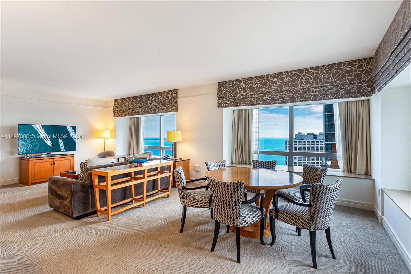 Escape to timeless luxury at the exclusive Four Seasons Brickell. This furnished 2 bedroom and 2.5 bathroom unit is located on the 36th floor (top floor of residence units) with views of Biscayne Bay, Key Biscayne bridge, and City views of Brickell & Marlins Park. Full kitchen with wood paneled appliances, office nook area, plenty of closet space and washer & dryer. One assigned parking space with access to valet parking and in addition one assigned private storage unit. Access to all first class amenities that the Four Season has to offer including 24/7 Equinox gym, pools, restaurants and spa. This is the epitome of luxury in Brickell. Great investment vehicle as it can be included in the hotel rental pool, or rented privately through Airbnb, VRBO, or reserved for family and friends.