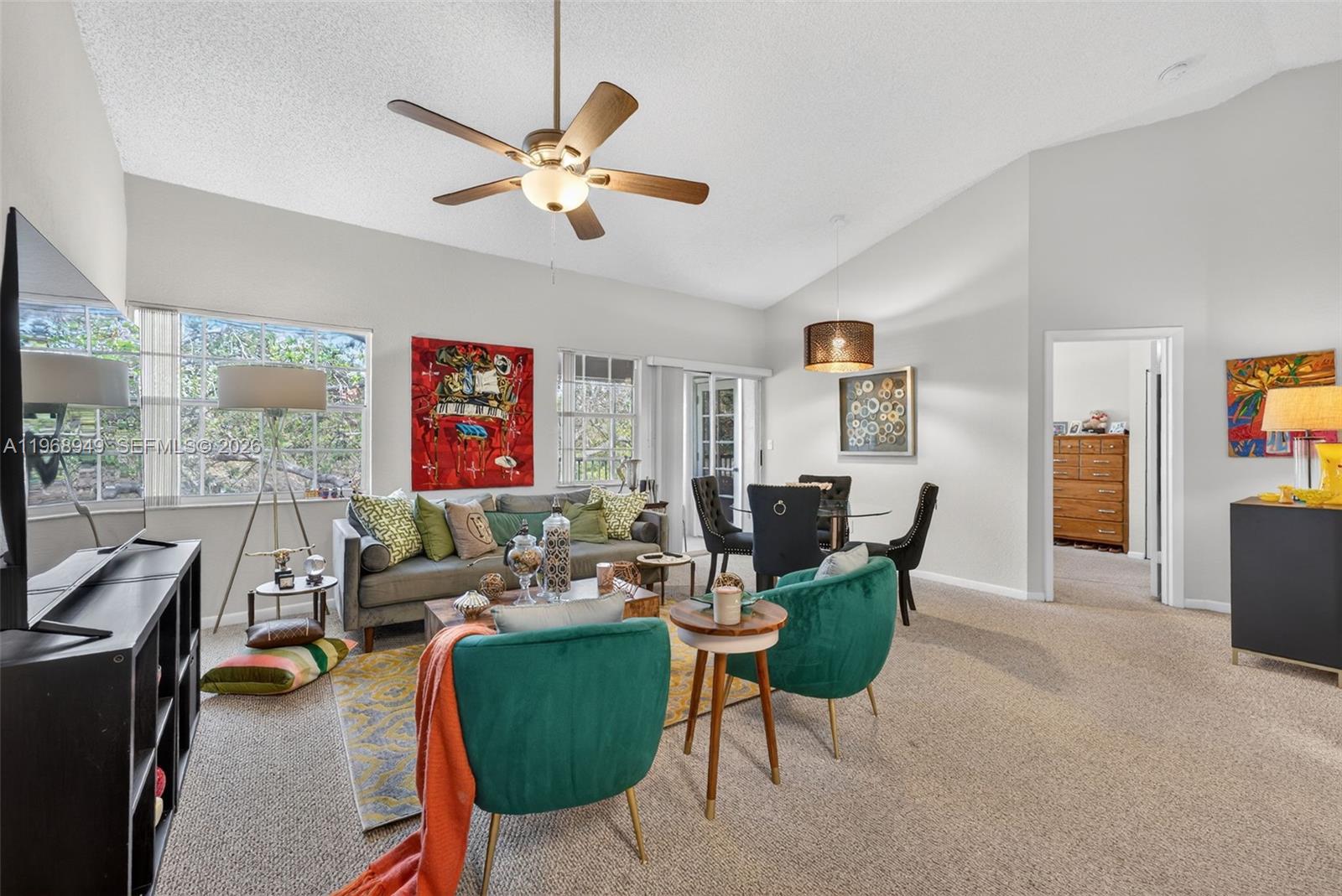 Spacious third-floor condo located in the desirable Lakeview Club community.  This well-maintained 2-bedroom, 2-bath residence features vaulted ceilings that create an open, airy feel and carpeted flooring throughout.  The home includes a full-sized washer and dryer and a screened balcony, perfect for relaxing and enjoying the Florida breeze.  The primary bedroom offers a generous walk-in closet and private en-suite bathroom. The second bedroom is versatile and can easily be used as a home office or guest room.  AC, electric water heater, and all kitchen appliances were replaced in 2020, with the washer and dryer upgraded in 2025.  The community offers resort-style amenities including 3 pools, hot tubs, tennis and racquetball courts, security-patrolled and ample parking.  The building is investor-friendly with immediate rentals allowed, making it ideal for a seasonal retreat, full-time residence, or investment property.  Conveniently located near shopping, dining, highways, and beaches!  Low HOA and no special assessments in place.