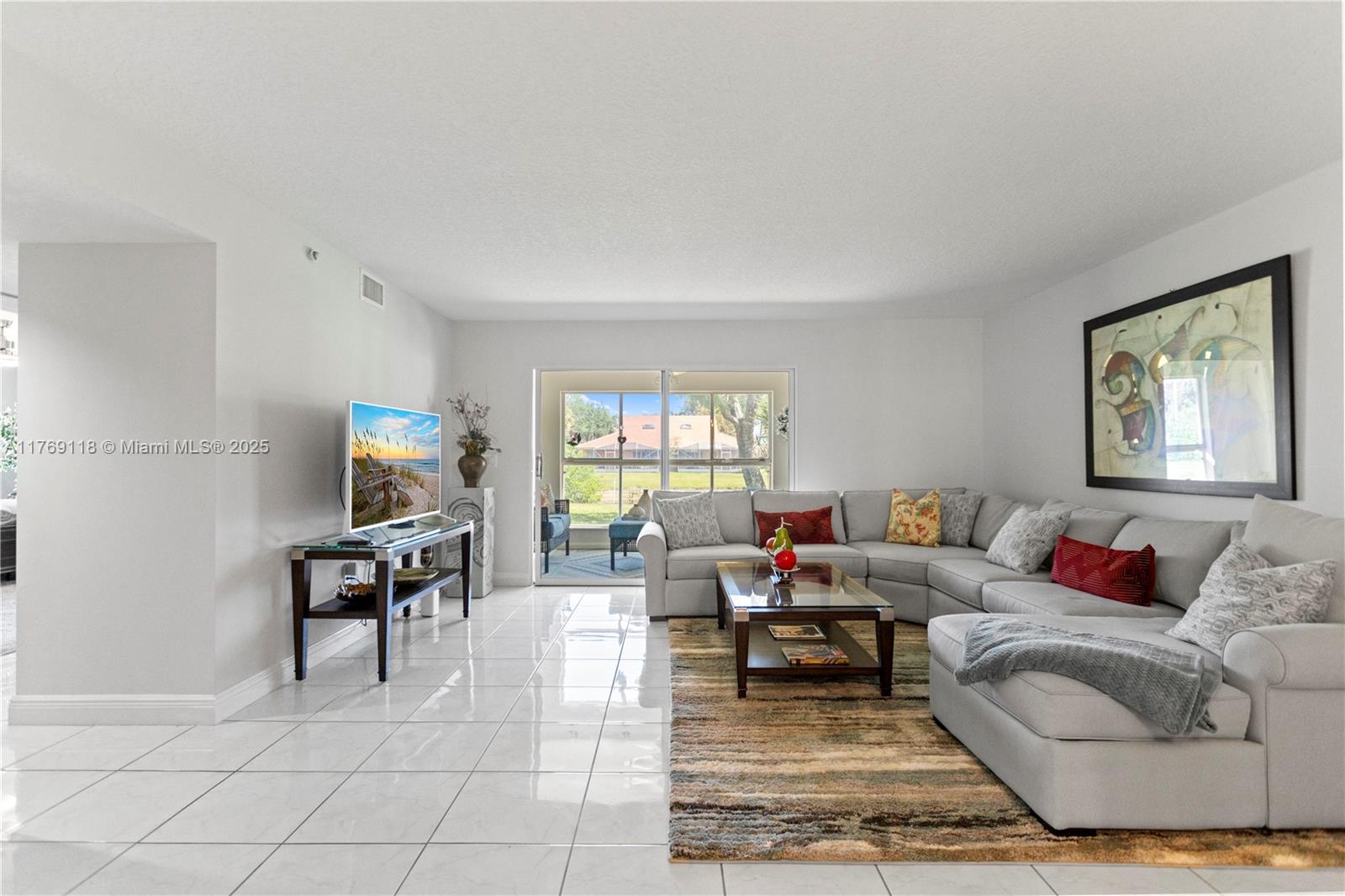 Welcome to this beautifully renovated 3 bedroom, 2 bathroom, end unit condo with lake front Florida room in the sought after Coral Lakes community. This bright and spacious home boasts brand new carpeting in bedrooms, creating a cozy atmosphere.  The kitchen is a true showstopper with brand new cabinetry, stunning quartz countertops, and all new stainless steel appliances. The convenience continues with a brand new washer and dryer in the dedicated laundry room. Enjoy the flexibility of the den, ideal for a guest space or reading nook.   Coral Lakes offers an array of resort style amenities withouth the high memberhip fees, including a clubhouse, indoor and outdoor pool, satellite pool within walking distance, fitness center, tennis courts, theatre, cafe, and many different clubs to be a part of.