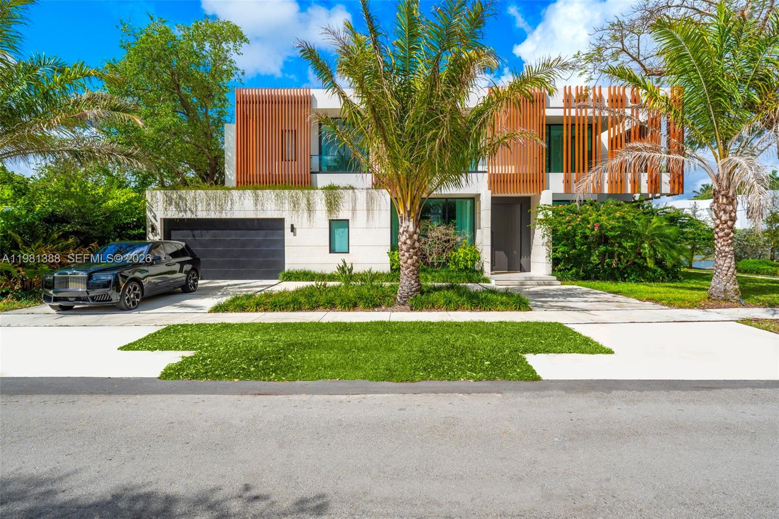 Step into a newly completed tropical modern estate by the Balli Group, designed by Balli-Trautman Architects and set in the prestigious Ponce Davis enclave. Spanning over 5,700 sq ft, this six-bedroom residence blends striking architecture with exotic materials, bespoke finishes, and seamless smart-home technology. Expansive living and entertaining spaces unfold around a spectacular chef’s kitchen and flow effortlessly into a lush tropical setting designed for unforgettable gatherings. The private primary suite and separate guest quarters offer exceptional comfort and privacy, while every detail reflects master-level craftsmanship. Located in one of Miami’s most sought-after estate neighborhoods known for its large homesites, tree-lined streets, and quiet residential character, this home delivers both serenity and proximity to the best of the city.
