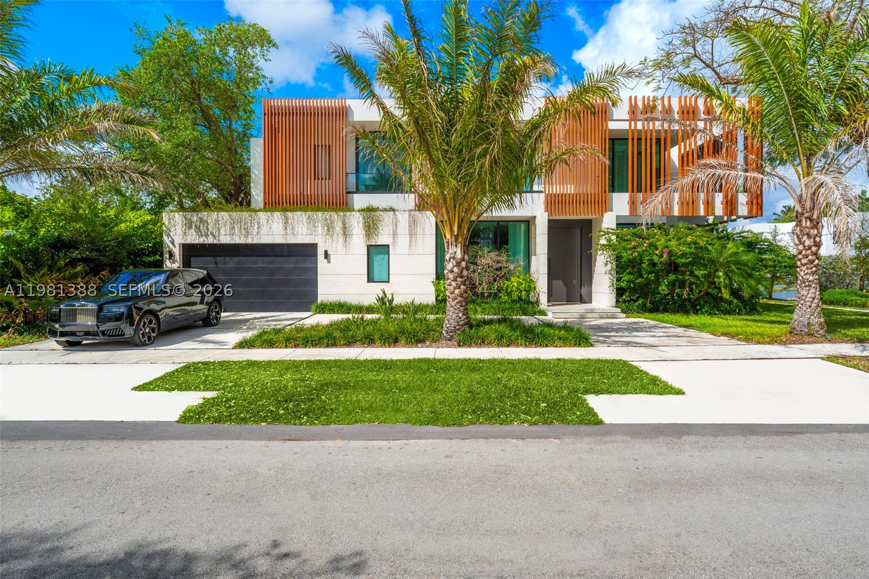 Step into a newly completed tropical modern estate by the Balli Group, designed by Balli-Trautman Architects and set in the prestigious Ponce Davis enclave. Spanning over 5,700 sq ft, this six-bedroom residence blends striking architecture with exotic materials, bespoke finishes, and seamless smart-home technology. Expansive living and entertaining spaces unfold around a spectacular chef’s kitchen and flow effortlessly into a lush tropical setting designed for unforgettable gatherings. The private primary suite and separate guest quarters offer exceptional comfort and privacy, while every detail reflects master-level craftsmanship. Located in one of Miami’s most sought-after estate neighborhoods known for its large homesites, tree-lined streets, and quiet residential character, this home delivers both serenity and proximity to the best of the city.
