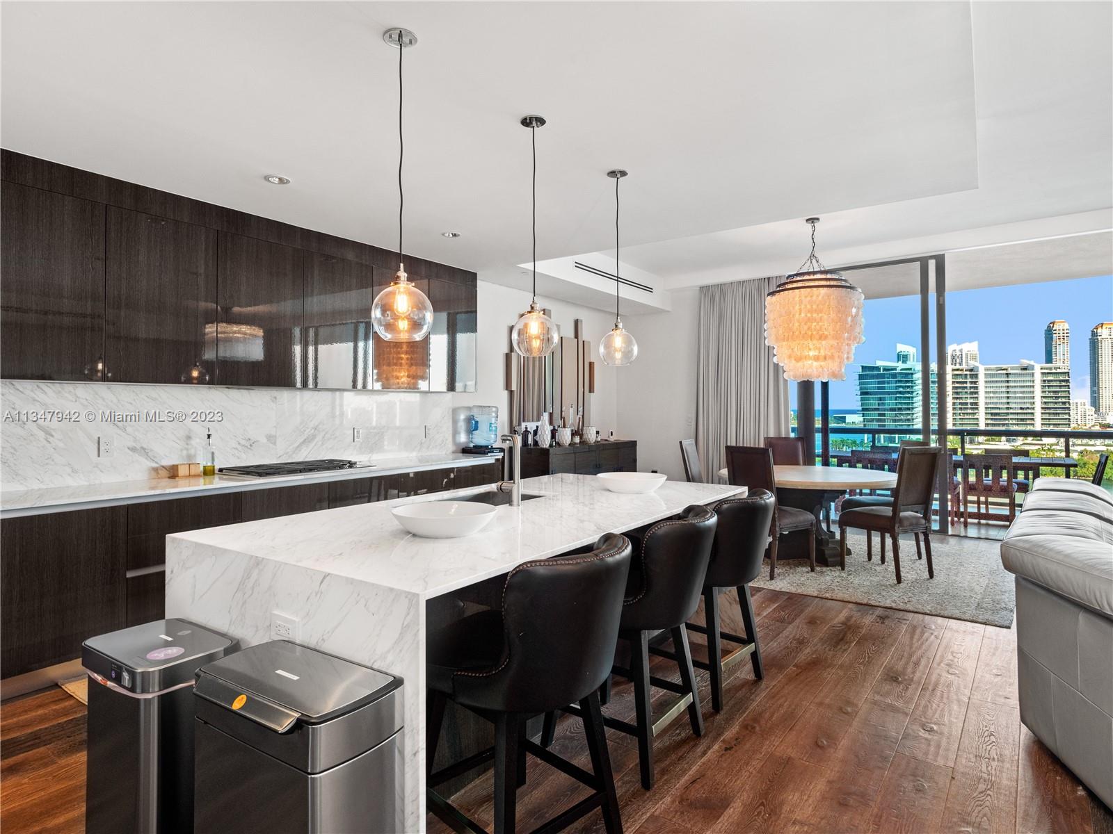 Introducing this one-of-a-kind Carlos Ott designed condominium at Echo Aventura. Modern yet luxurious, a private elevator ascends directly into the flow-through residence infused with stunning interiors and smart-home technology. Boasting 3,290 SF of open living, this three bed plus den residence comes fully furnished by Restoration Hardware. Enjoy breathtaking views while entertaining in style from an expansive balcony equipped with a summer kitchen and BBQ grill. The master suite includes a midnight kitchen, oversized bath, and walk-in closet. An additional service suite with a maids quarters which can be used as a fourth bedroom. Five-star building amenities include a bayfront infinity-edge pool, a 4,000 SF fitness center, dog walking service, and a restaurant.