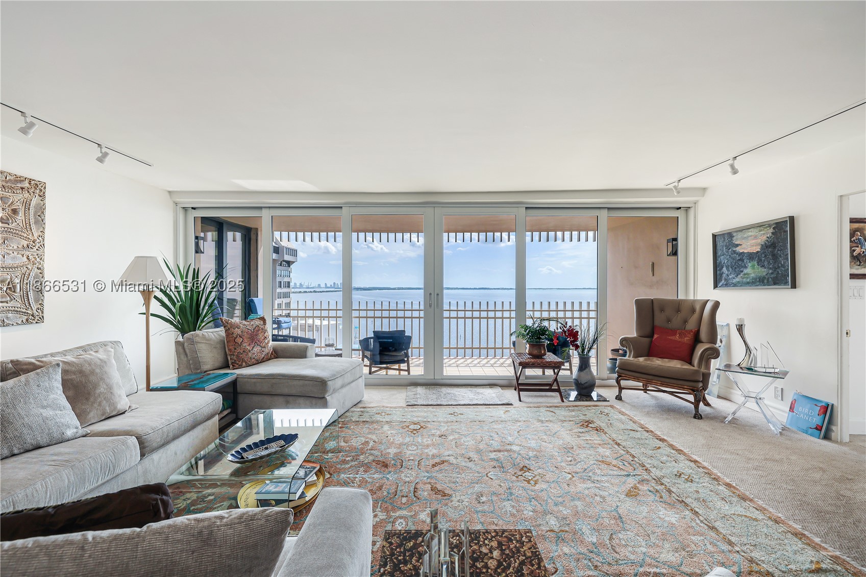 Stunning views from this high-floor residence in the highly coveted 03 line at Grove Isle. This spacious 2-bedroom, 2-bathroom apartment features one of the most desirable floor plans in the building, offering a split layout, a den, and a convenient laundry closet. The open kitchen is equipped with stainless steel appliances, and the residence features impact windows throughout. Ideal for those seeking a luxurious waterfront lifestyle with breathtaking views on Coconut Grove’s only gated private island.