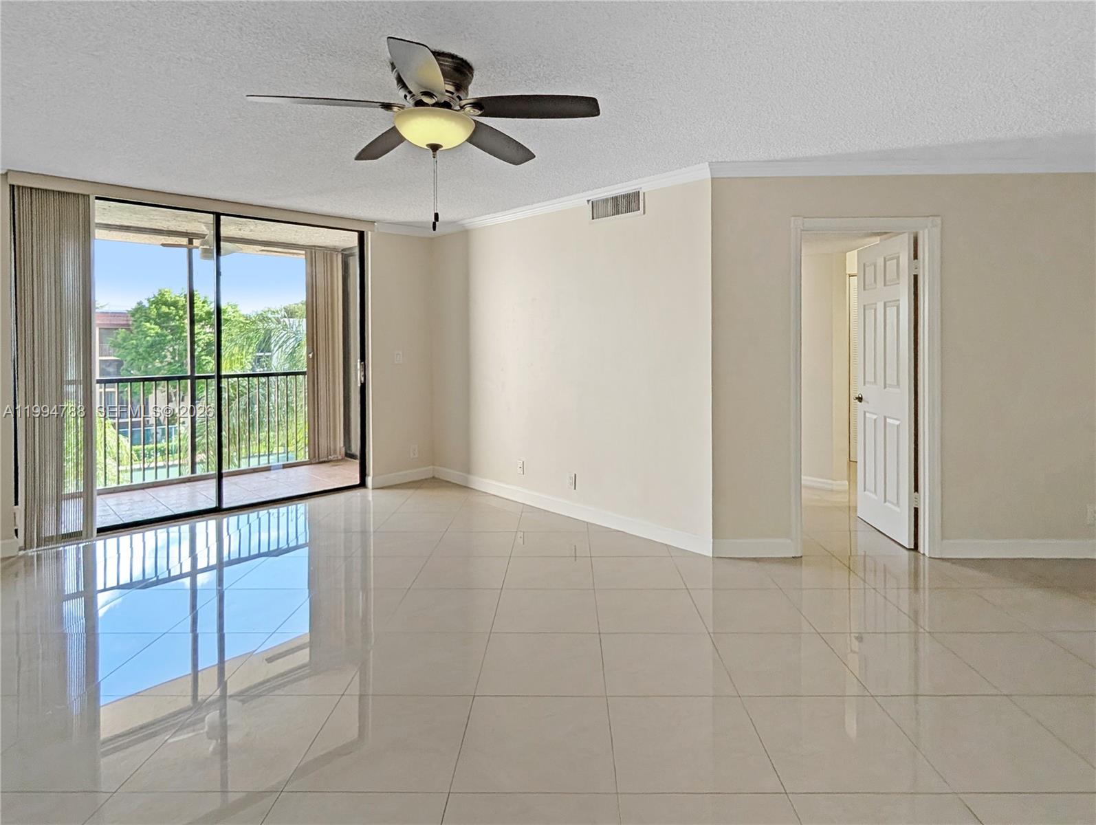 Rare opportunity to own the best-priced unit in Plantation Racquet Club - and it shows. Perched on the highest floor, this stunning 2BD/2BA condo delivers breathtaking sunsets, pool, and tennis court views from your private balcony. At 950 sqft, the layout is open, flowing, and surprisingly unique - nothing cookie-cutter here.

Inside, you'll find crown molding throughout, an abundance of natural light, generous closet space throughout, washer and dryer in the unit, and a private storage room - the details that make everyday living effortless. Every window is equipped with accordion shutters for full storm protection and peace of mind. The building itself is a standout: spa, pool, 4 tennis courts, ample parking, and private security on-site every night — all within a well-run association with HOA dues covering water and, best of all, FULLY FUNDED reserves.

Location is unbeatable. One block from American Heritage School, minutes to Sawgrass Mills, Central Park, University Drive, I-75, I-595, 20 minutes drive to FLL & beaches, and a full lineup of restaurants and shopping. Whether you're a first-time buyer, investor, or downsizing - this one checks every box. Move fast.