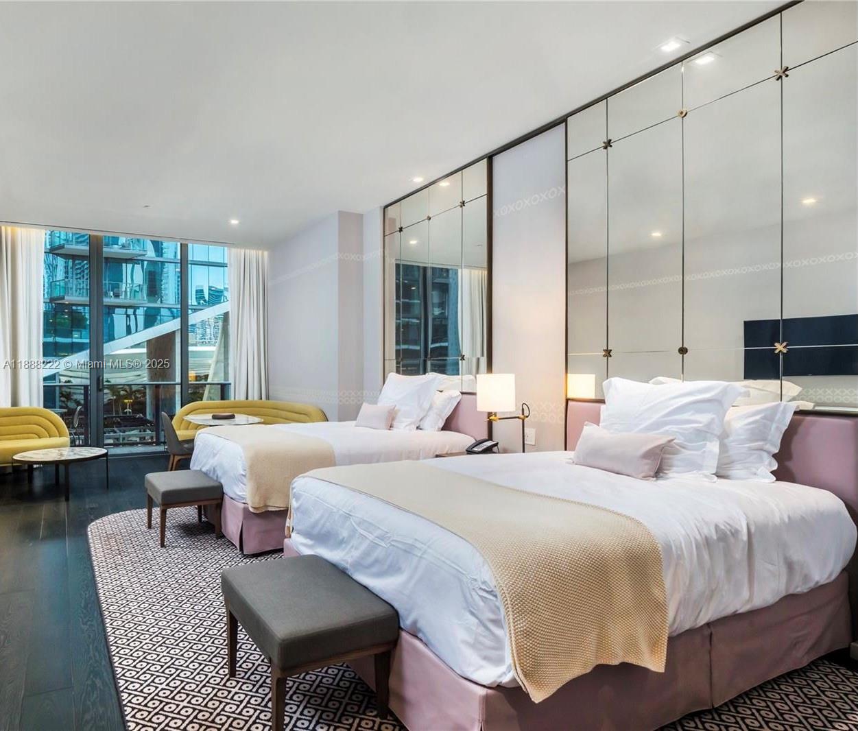 Experience the best hotel suite floorplan with 2 queen beds and a private den at SLS LUX, the most desirable hotel and residence in Brickell. Fully furnished with the option for daily rentals, this unit features Smart Home Technology, Italian kitchen cabinetry with top-tier appliances, rain showers in the master bath, and floor-to-ceiling glass walls. Enjoy a spacious balcony with breathtaking city and bay views. Indulge in 5-star amenities including pool, cabanas, poolside bar, BBQ area, gym, spa, tennis, basketball, party room, concierge, and 24/7 security.