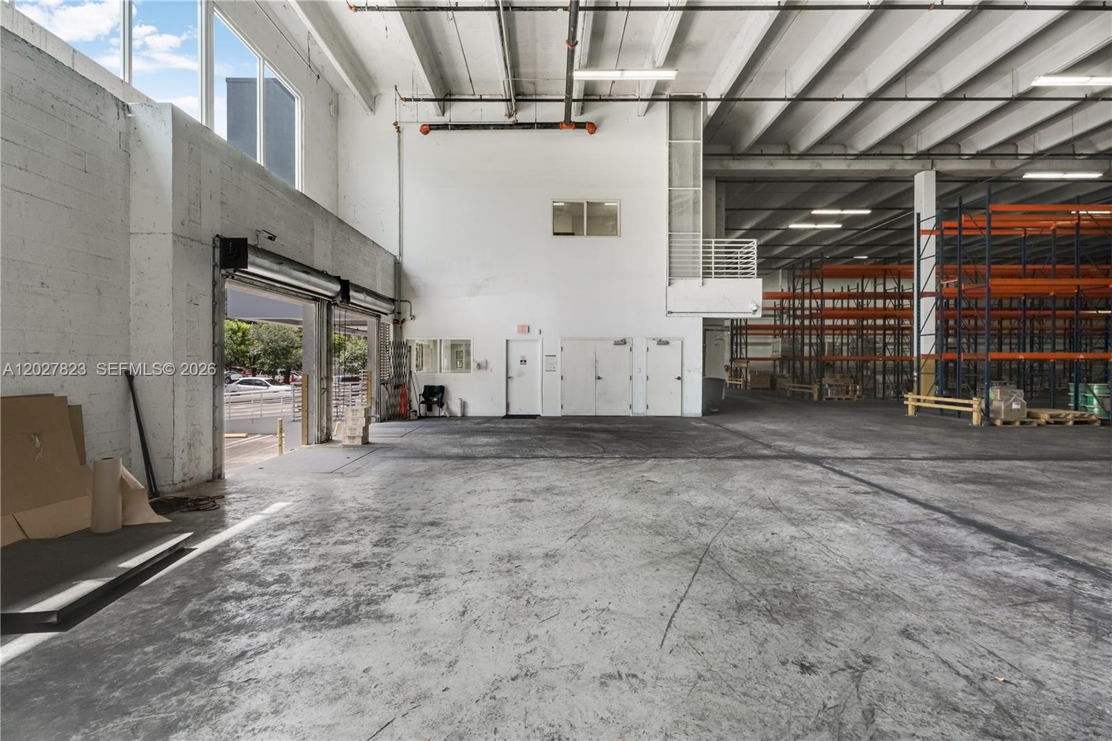 Strategic and premium location in the heart of Doral! Presenting an exceptional freestanding commercial warehouse available for lease starting August 1st. This move-in ready property features 18,509 SF of leasable space (19,605 SF total building area) sitting on a generous 0.97-acre lot, offering an outstanding infrastructure for distribution, logistics, and corporate operations. Property highlights include a high 22-foot ceiling clearance and 4 high docks, high-volume shipping, receiving, and efficient fleet management. The property has been completely upgraded in 2024, Soon ceramic floor tiles renovation, a freshly painted interiors, turnkey storage racks, and high-efficiency LED lighting throughout. Heavy-duty operations are fully supported by a robust power supply, equipped with both 110V and 220V electrical hookups. Safety and compliance are top-tier, featuring a fully integrated automatic wet sprinkler system with active fire monitoring and smoke alarms. The exterior provides an extensive parking capacity with 24 spaces on-site, a critical and highly competitive advantage in the Doral industrial market. Offered under a flexible Modified Gross lease structure with projected 1 to 3-year terms. Tenant pays for specific utilities and maintenance as per lease structure. Do not miss this turnkey industrial opportunity in one of South Florida's premier logistics hubs. Easy to show. Schedule your private tour today!