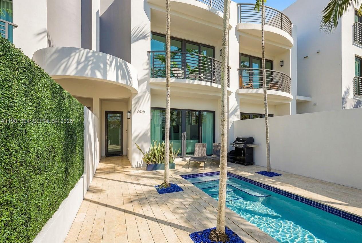 Situated in the sought-after Victoria Landing community in Victoria Park, just steps from Holiday Park and minutes to Las Olas, the beach, and Fort Lauderdale’s best dining and lifestyle, this tri-level townhome offers nearly 3,500 sqft under air.

Featuring 3 bedrooms, 3.5 bathrooms, a private elevator servicing all floors, and a 2-car garage, the home offers spacious bedrooms, abundant closet and storage space, and upgraded porcelain tile flooring throughout.

A private gated entry opens to a tropical courtyard with pool, lounge area, and BBQ, creating a true outdoor retreat. The main level features a bright open-concept layout with quartzite kitchen, bar seating, KitchenAid appliances, electric fireplace, and expansive sliding doors.

The second level offers expansive bedrooms, a luxurious primary suite, and a flex space ideal for a home office.

The entire third floor is designed for entertaining, featuring a third bedroom and a spacious entertainment loft with projector screen, built-in speakers, and a bar with wine cooler, opening to an expansive rooftop terrace overlooking Victoria Park and the city.