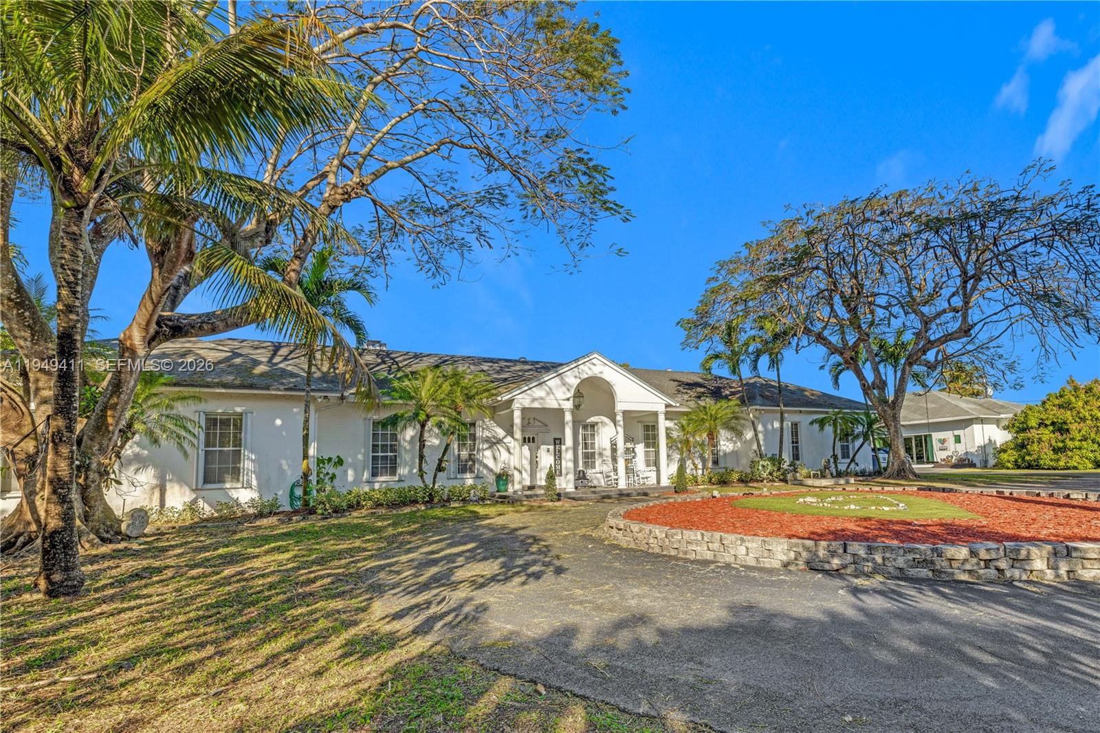 Beautiful gated Estate on over4 acres in prime Redland, just north of RF Orchids. RoyalPalm-lined driveway leads to a grand entrance. Over 7 thousand sf compound offering a privacy and tranquility only 35 minutes south of Downtown Miami. Features include private living room, formal dining room, breakfast nook, family room with Chicago brick fireplace, Florida room, large bedrooms, and attached 2 car garage. Detached A/C workshop/building with open espace, closet and 2 fully remodeled bathrooms - ideal for events, gatherings, or flexible use. Fully working Mango Farm with over 300 mature trees with Diesel irrigation system and additional drip system.
Private showings by appointment only.