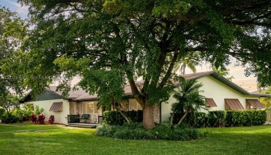 Own this Turnkey Ag-residential gem with Built in Greenbelt tax relief! Home offers a Bonus room which FHA financing will consider as an additional bedroom so this 3 to 4 BR,2 BTH property is set on 1.16 fully fenced acres in the Redlands. This AG classification also features : 2 operational wells, a complete irrigation system, new impact windows, a pool with saltwater chlorine system, 12 yr old roof, mature landscaping, sunroom and an oversize garage with walk - up storage space above. A prime location as it is a permanently protected buffer against the rapid growth of South Florida offering privacy, and expansive open space. Some people will see open land .Others will see opportunity. Agricultural zoning is becoming harder to find. Greenbelt tax savings for the buyer provides higher ROI potential. The property is an incredible Blending of "Old Florida" charm with modern comforts. the interior features a spacious floor plan with beautiful Mexican tile flooring throughout the living areas, including separate dining room, a cozy fireplace, and an inviting sunroom. The eat-in kitchen is fully equipped with all-new appliances, bedrooms recently upgraded with brand-new carpeting and plenty of closet space.
Safety is prioritized with X zone category. The pool area is perfectly wired with ambient lighting. The oversized garage provides ample room for three vehicles and is a dedicated laundry area with W/D included. A shed for tools and equipment out back wraps this pkg with a bow.