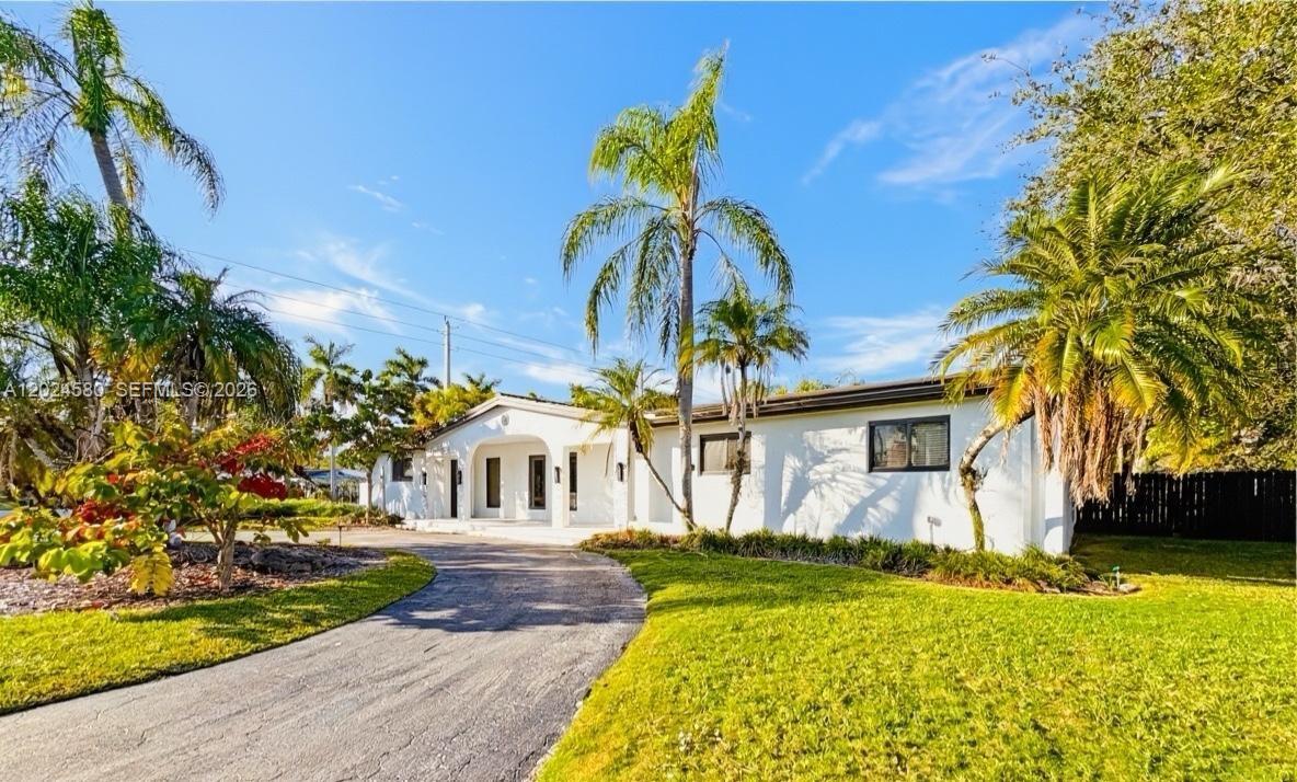 Perfectly situated on a lush 15,000 SF lot in a desirable non-flood zone, this exceptional 5BR/3BA home is designed for both comfort and entertaining. It features bright formal living and dining areas that flow into a spacious family room with a glass-enclosed bar/wine display. The kitchen boasts white quartz countertops, stainless appliances, double ovens, a cozy breakfast area, and a generous pantry.The primary suite offers a walk-in closet, wall-to-wall storage, an en-suite full bathroom, and a beautiful pool view. A second bedroom features a private full bathroom, a generous walk-in closet, and a private entrance. Additional bedrooms feature side-by-side closets, providing the perfect opportunity to customize.Step outside to your private resort: an expansive screened terrace, oversized pool, fire pit, wood deck surrounded by lush palms and trees. Key highlights include impact windows/doors throughout, a 5-year-old roof, a 1-car garage with an impact glass door, a 1-car carport, boat parking, sprinkler system, and a driveway for 5+ vehicles. Located just minutes from Baptist Hospital, top-rated schools, Dadeland Mall, The Falls, and Whole Foods with easy access to the 826 Expwy and US-1, this home offers the perfect blend of space, security, and lifestyle!