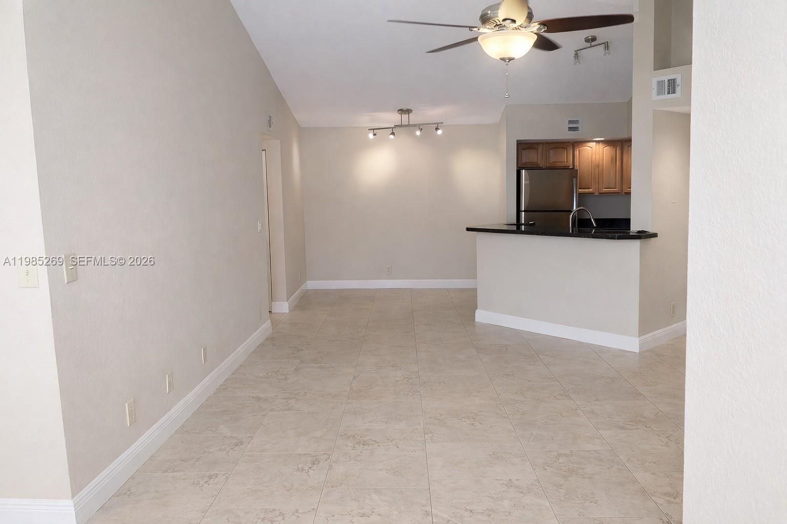 Fantastic opportunity to own a spacious 2-bedroom, 2-bathroom residence (Unit 827) featuring vaulted ceilings and ceramic flooring throughout. This unit boasts granite countertops, stainless steel appliances, and an open layout with plenty of natural light. Long-term tenant in place, making this an ideal addition to any investment portfolio. Residents enjoy premium community amenities including two swimming pools, a spa, fitness center, and tennis courts. Conveniently located near major expressways and shopping. HOA requires a minimum 620 credit score. Please allow 24-hour notice for showings.